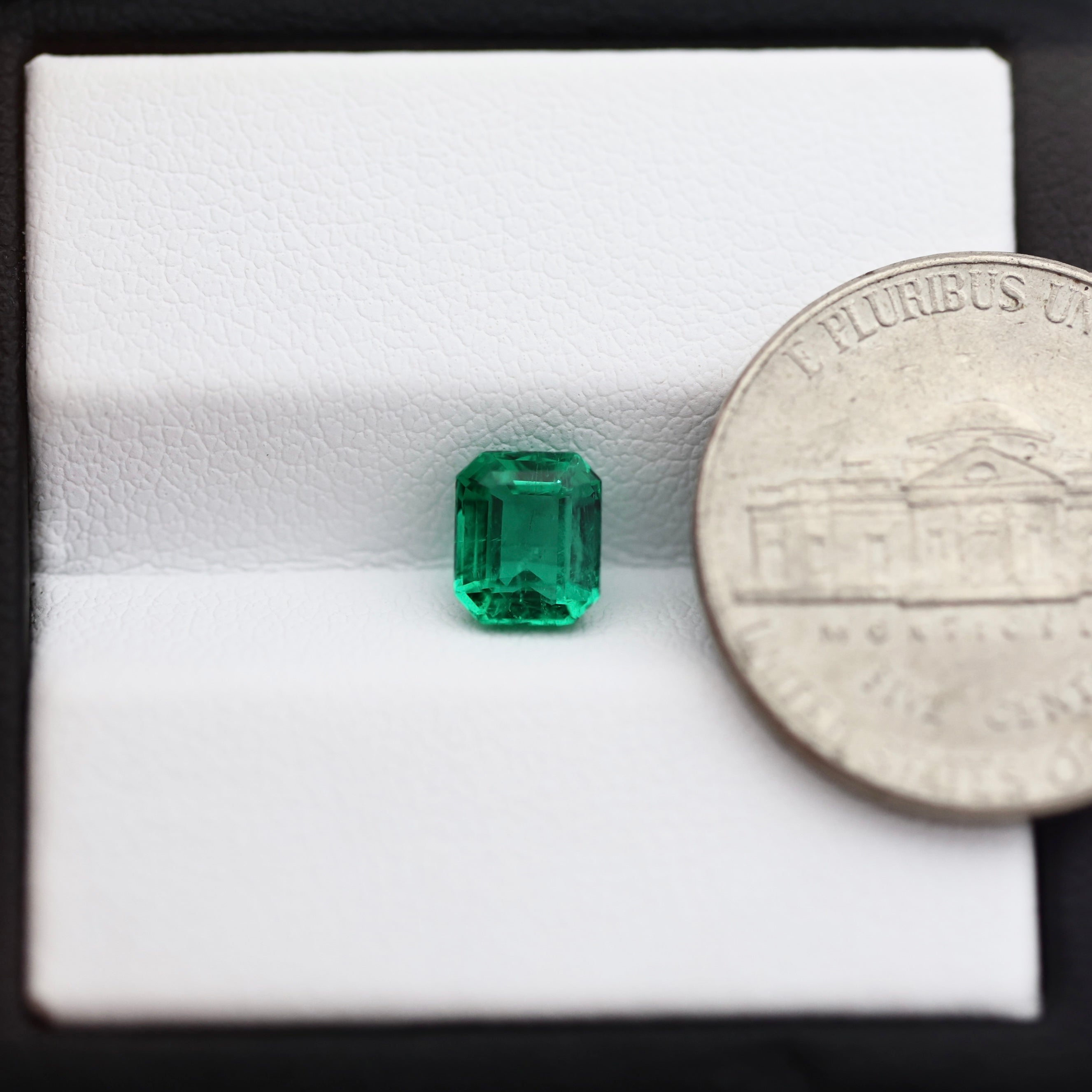 colombian emerald with coin