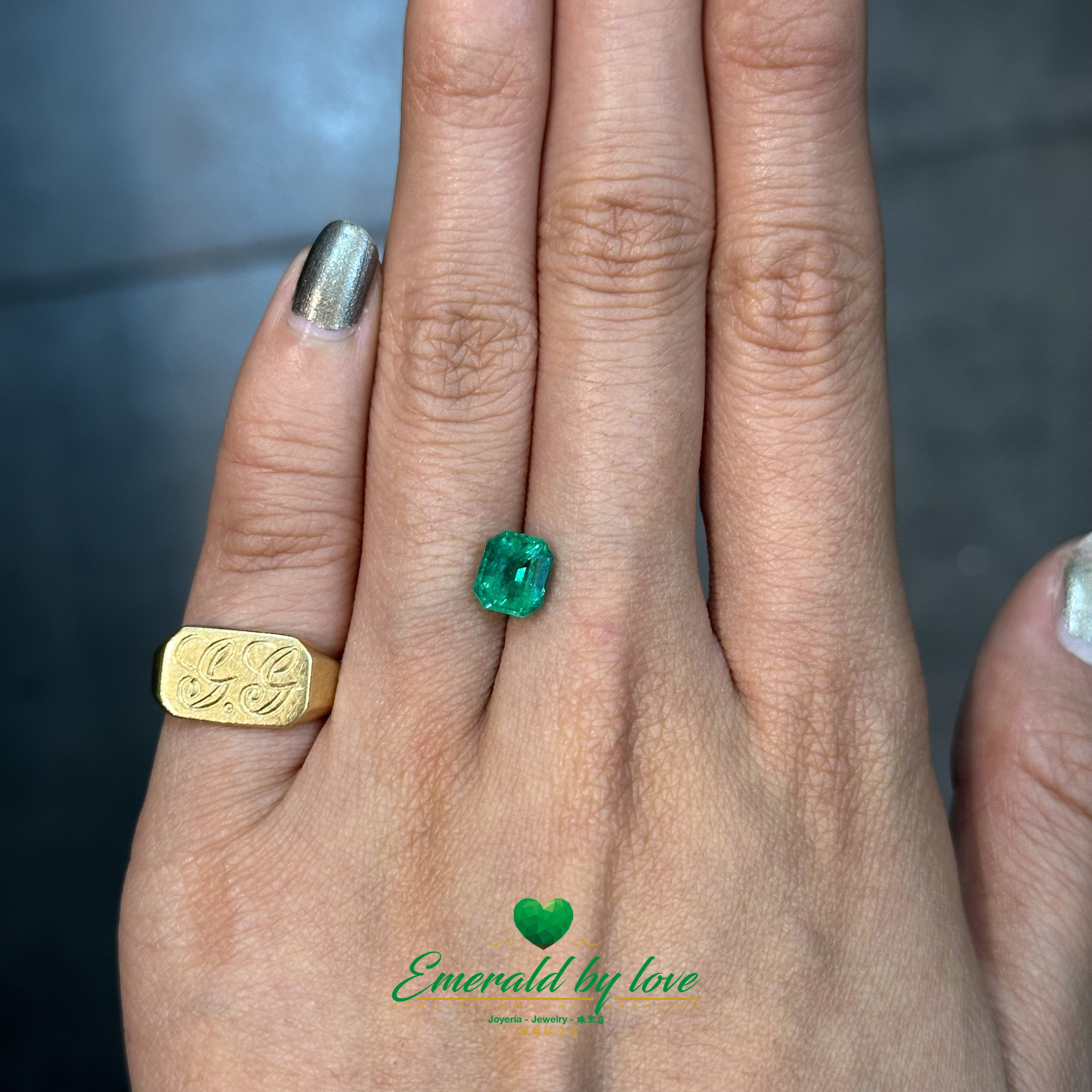 Elegant 1.24 carat emerald-cut Colombian emerald with vibrant green tone and clear structure