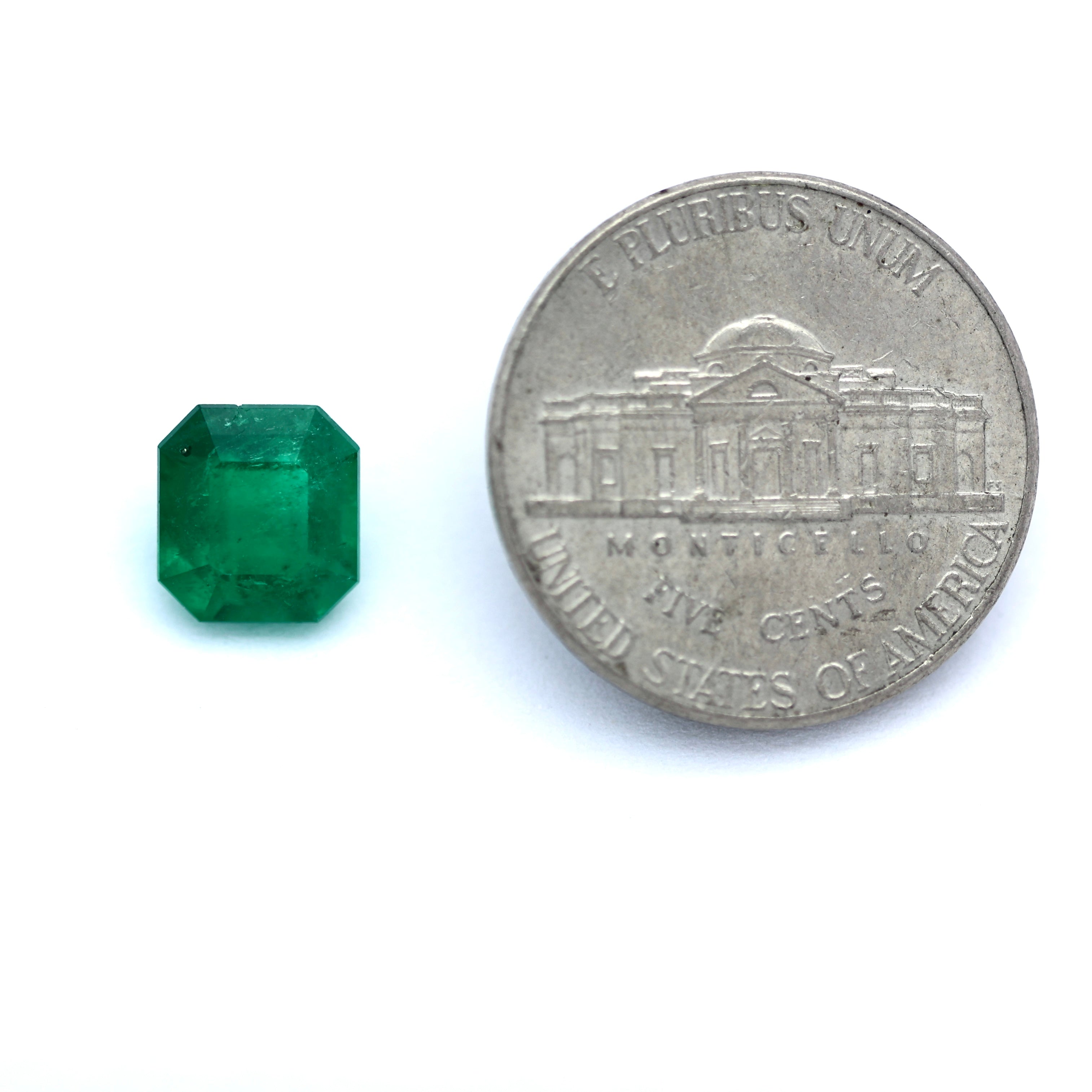 comparison coin with square emerald