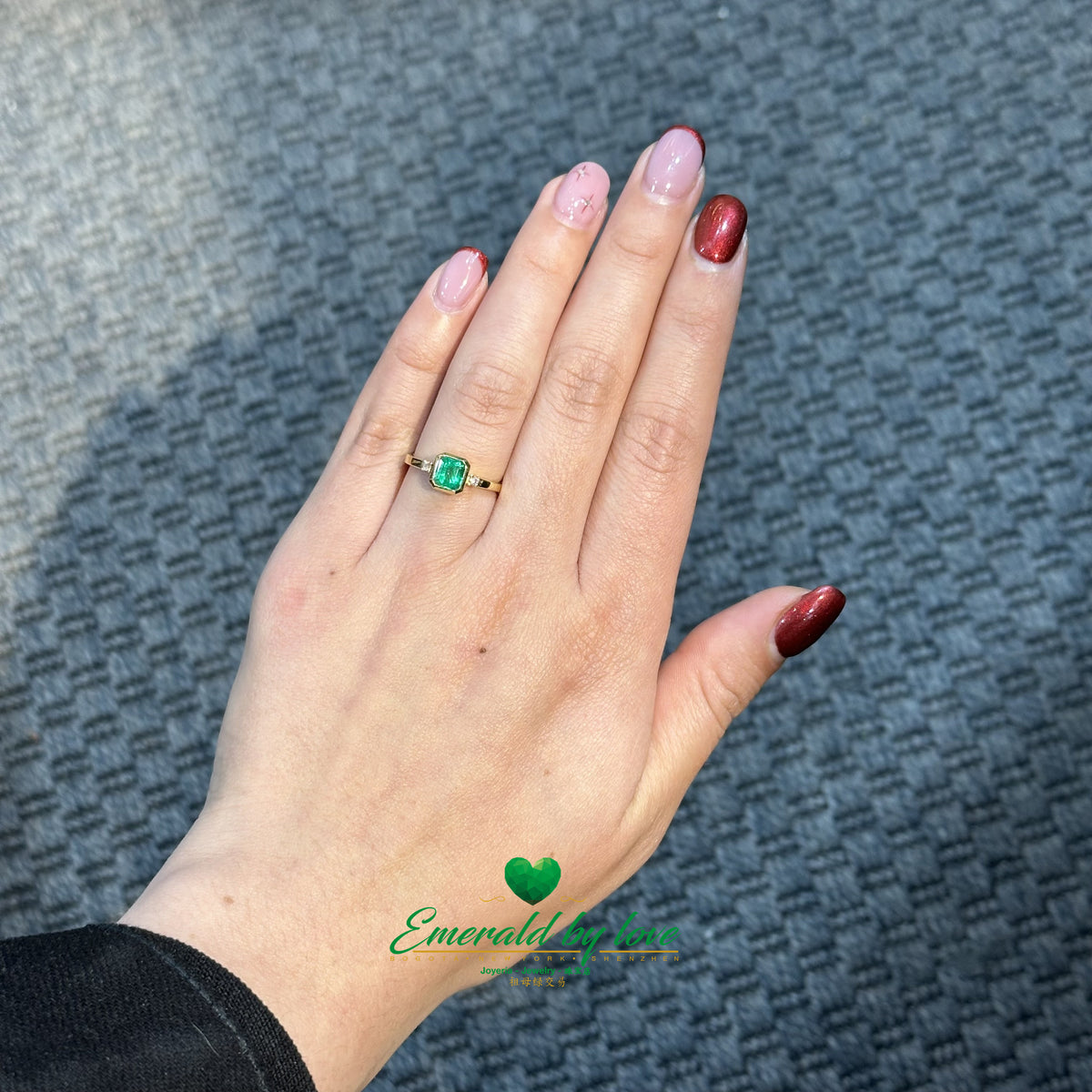 18K Yellow Gold Emerald Ring with Bezel-Set Center Stone and Side Diamonds