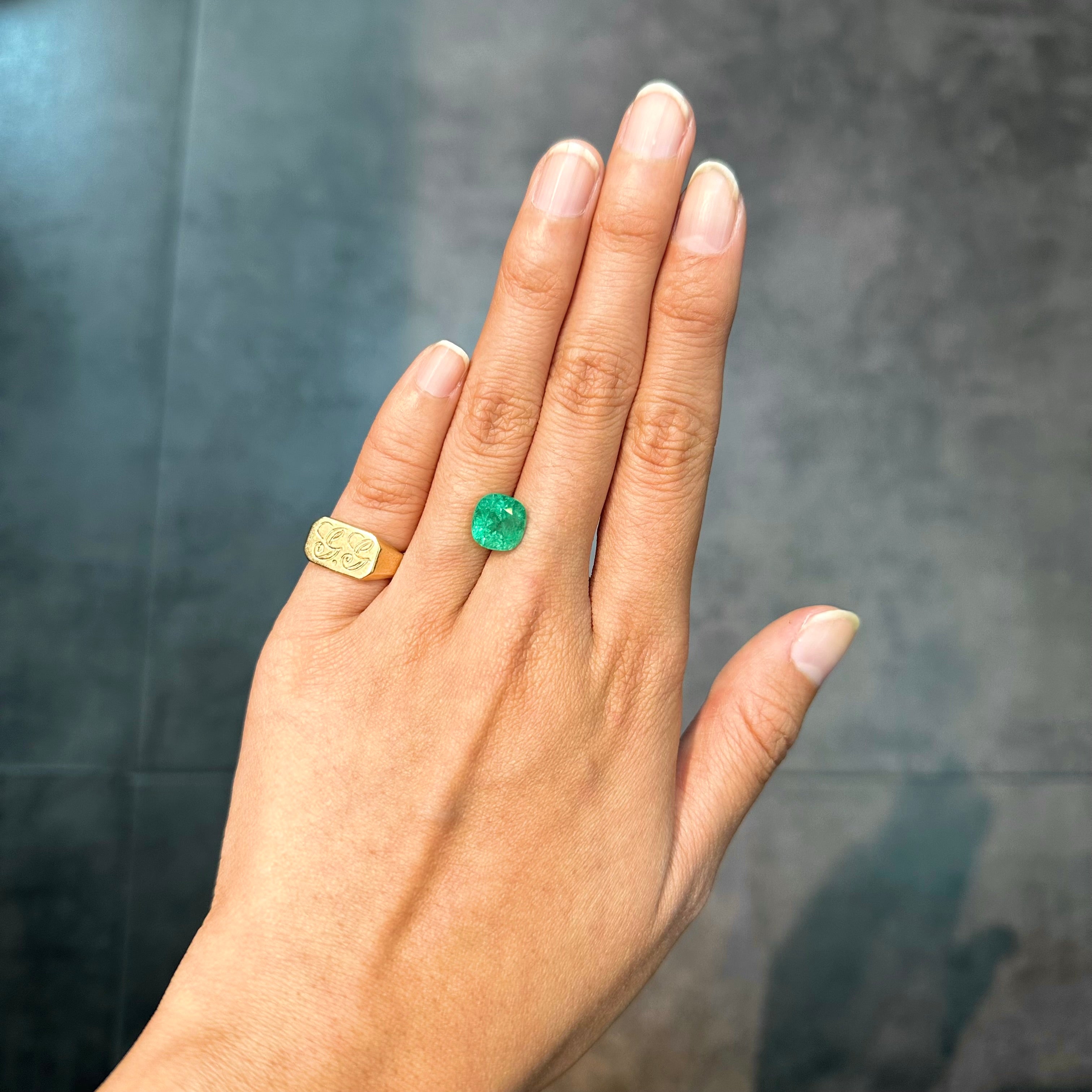Colombian cushion emerald, 3.43 carats, with vivid green color and a naturally elegant appearance