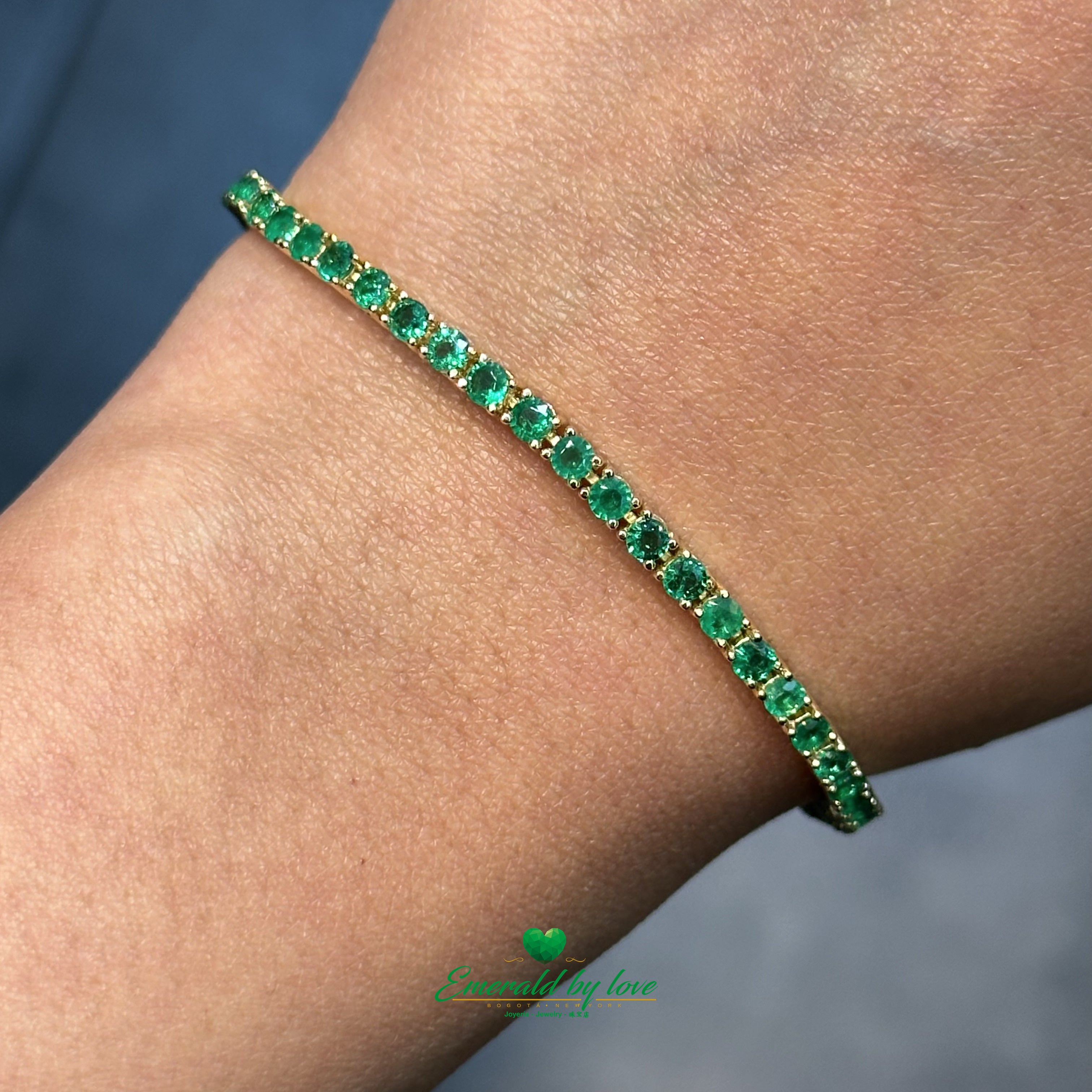 Slim Tennis Bracelet in 18K Yellow Gold with Prong-Set Colombian Emeralds and Diamond Clasp