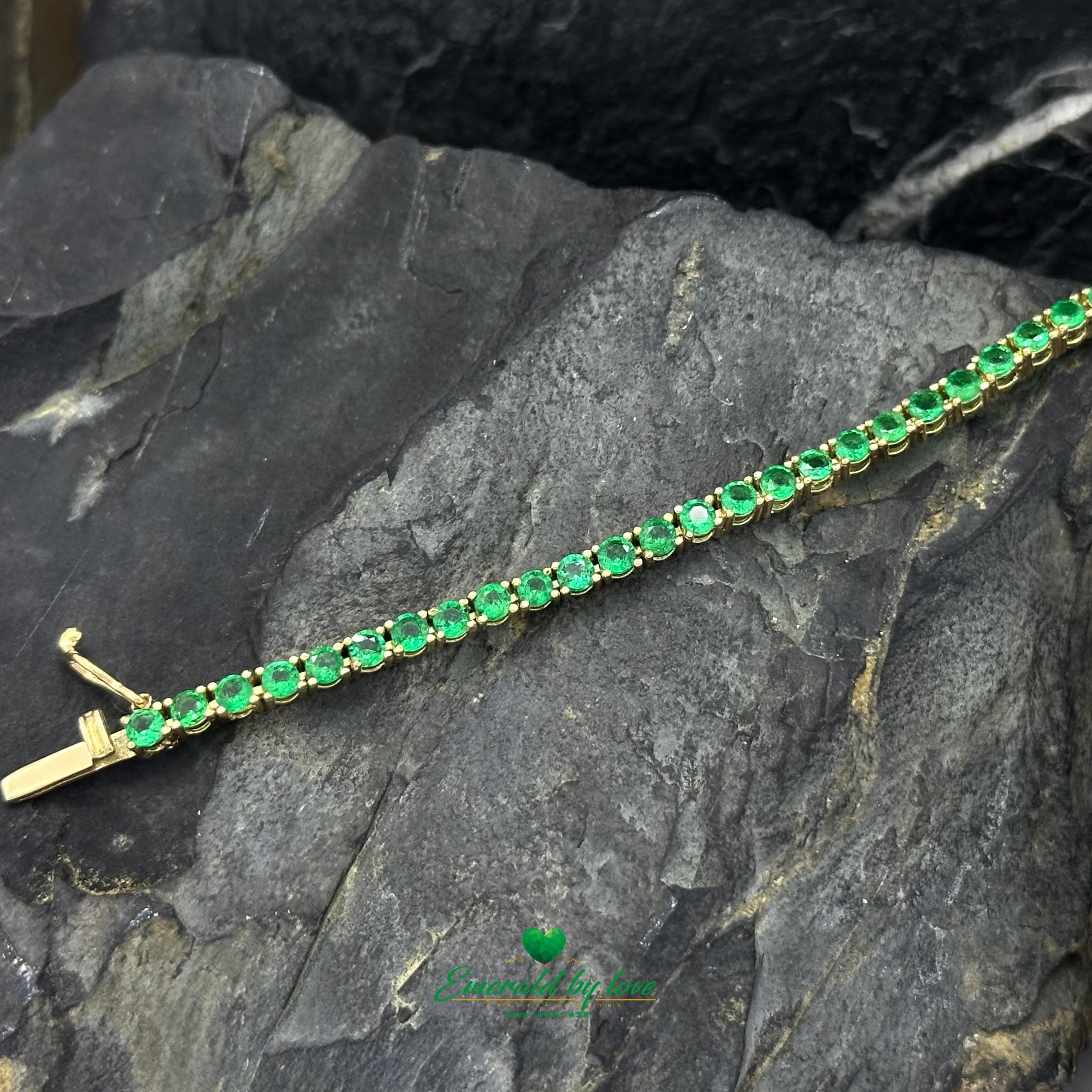 Slim Tennis Bracelet in 18K Yellow Gold with Prong-Set Colombian Emeralds and Diamond Clasp