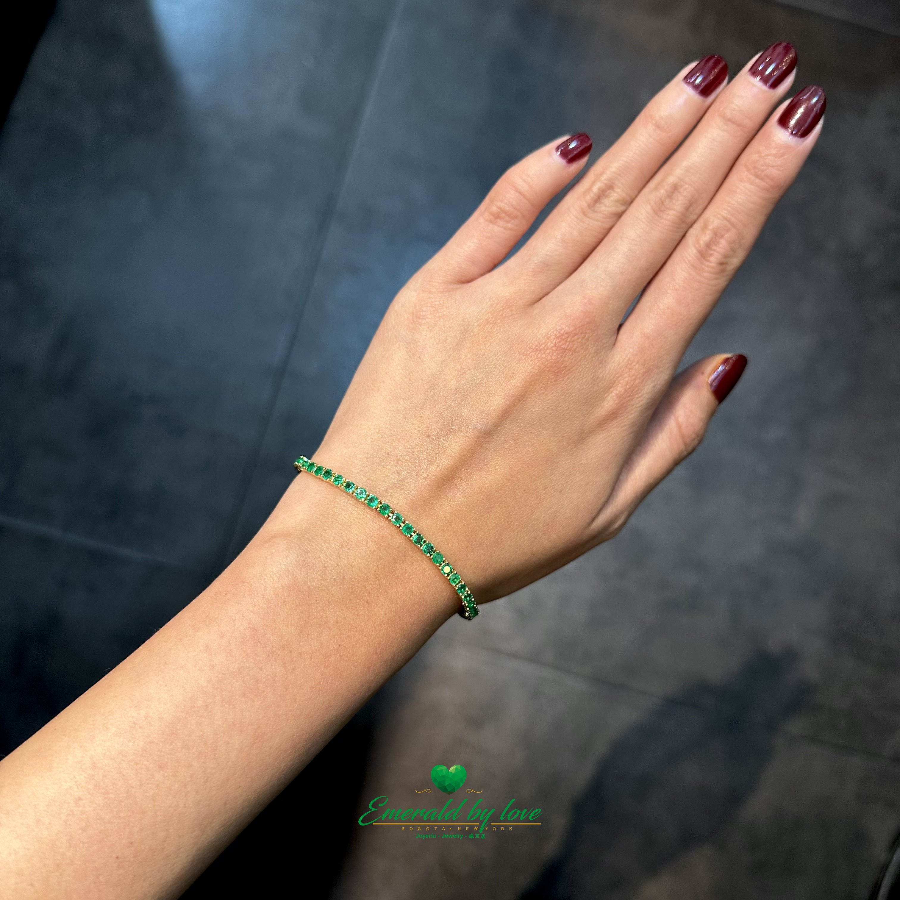 Slim Tennis Bracelet in 18K Yellow Gold with Prong-Set Colombian Emeralds and Diamond Clasp