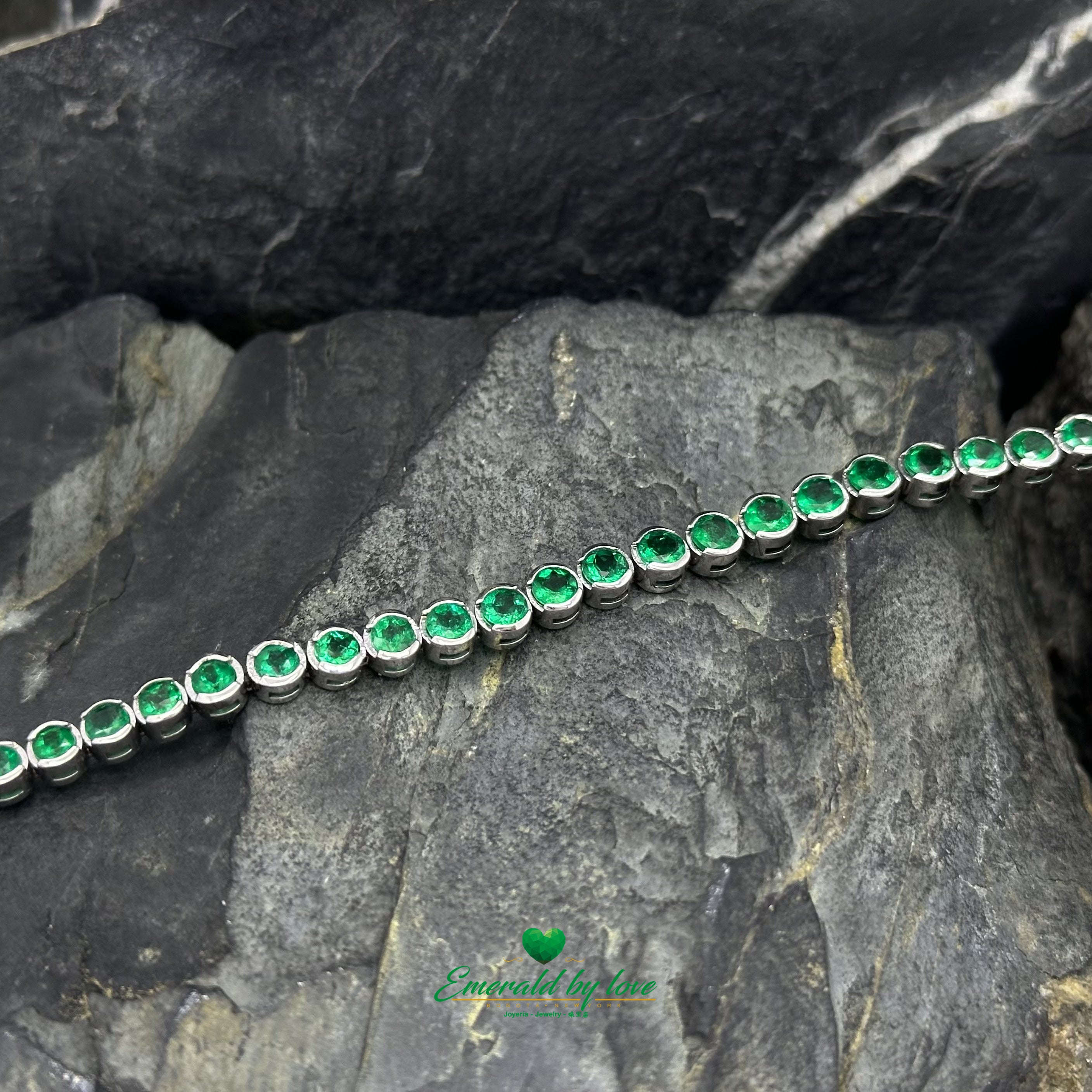 Tennis Bracelet in 18K White Gold with Bezel-Set Round Colombian Emeralds