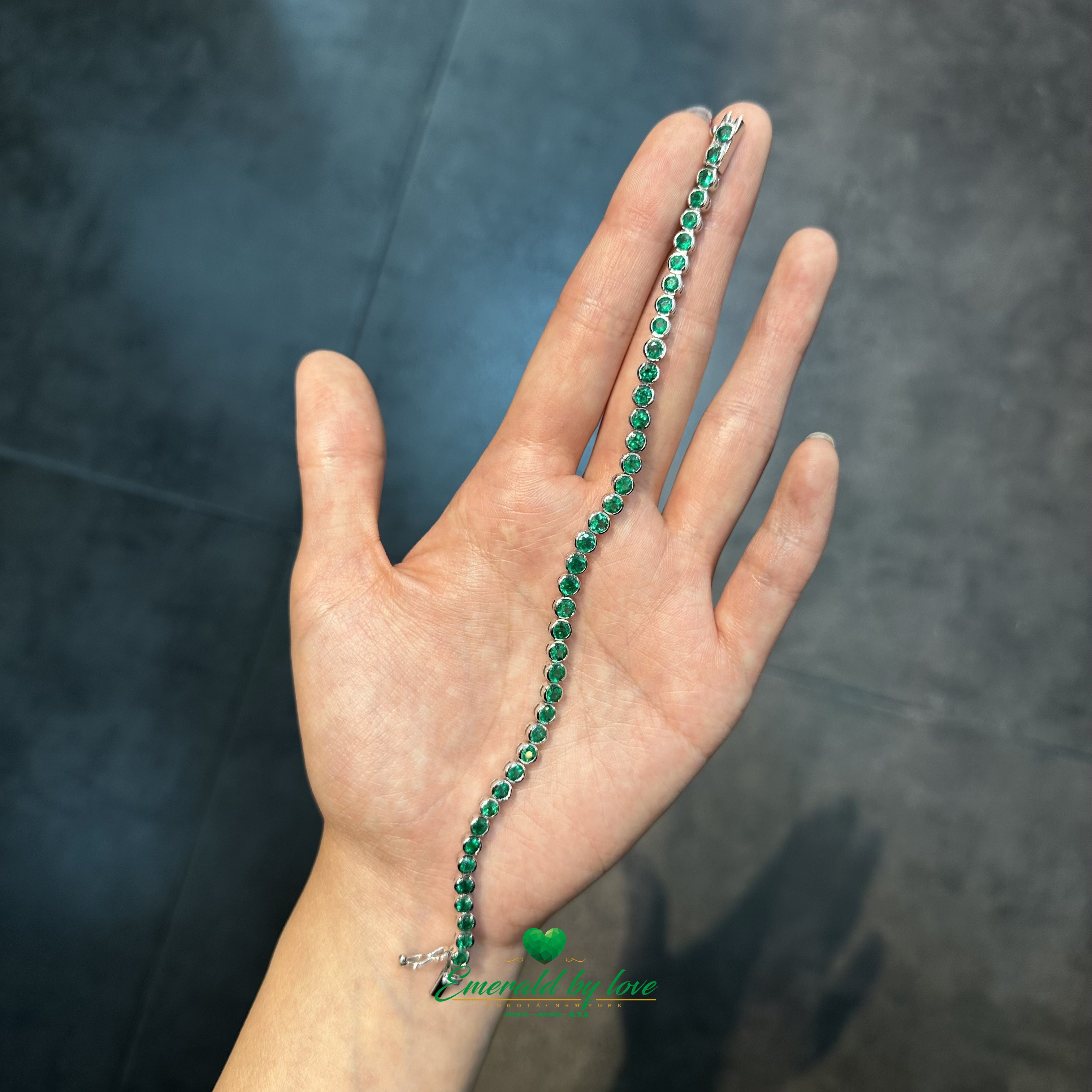 Tennis Bracelet in 18K White Gold with Bezel-Set Round Colombian Emeralds