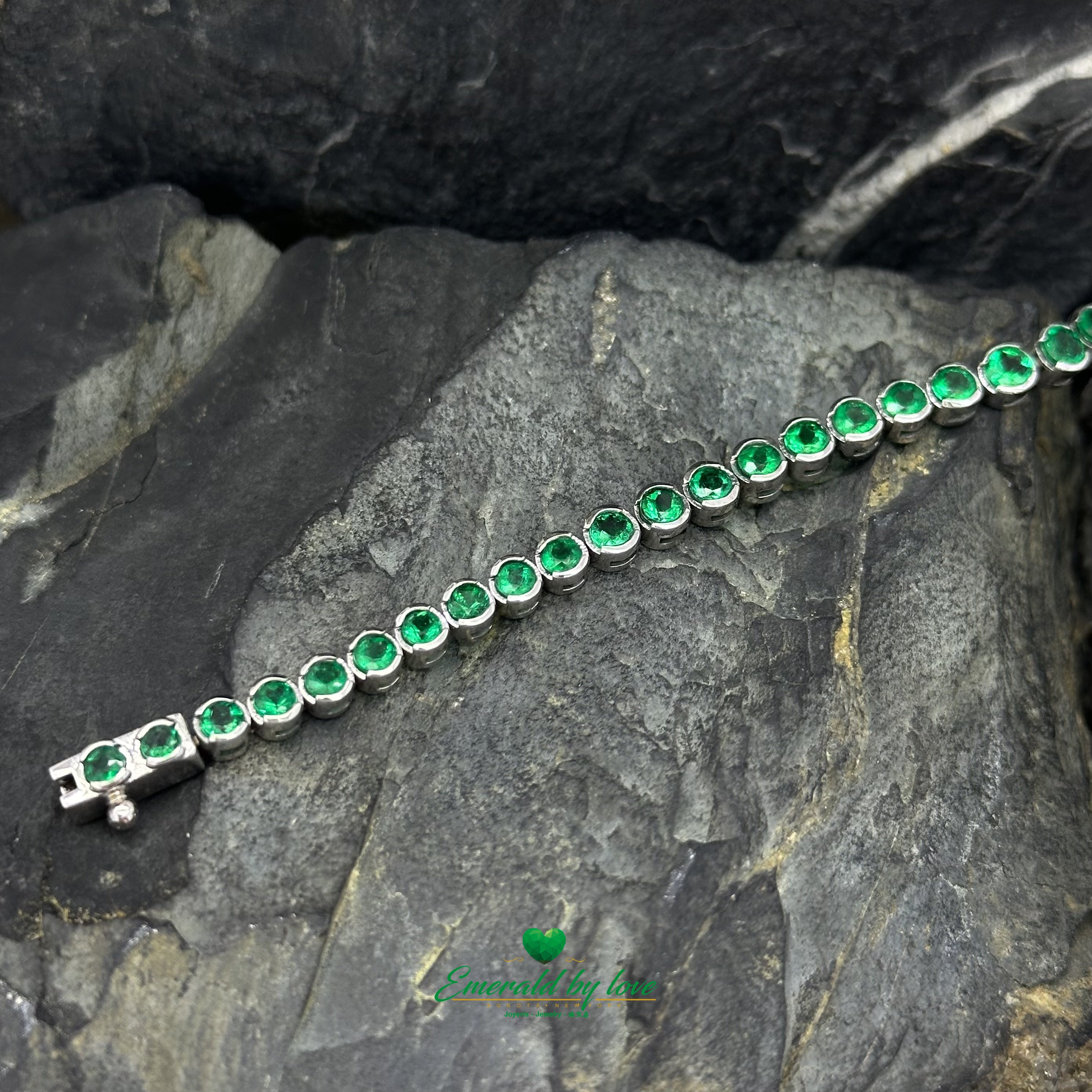 Tennis Bracelet in 18K White Gold with Bezel-Set Round Colombian Emeralds