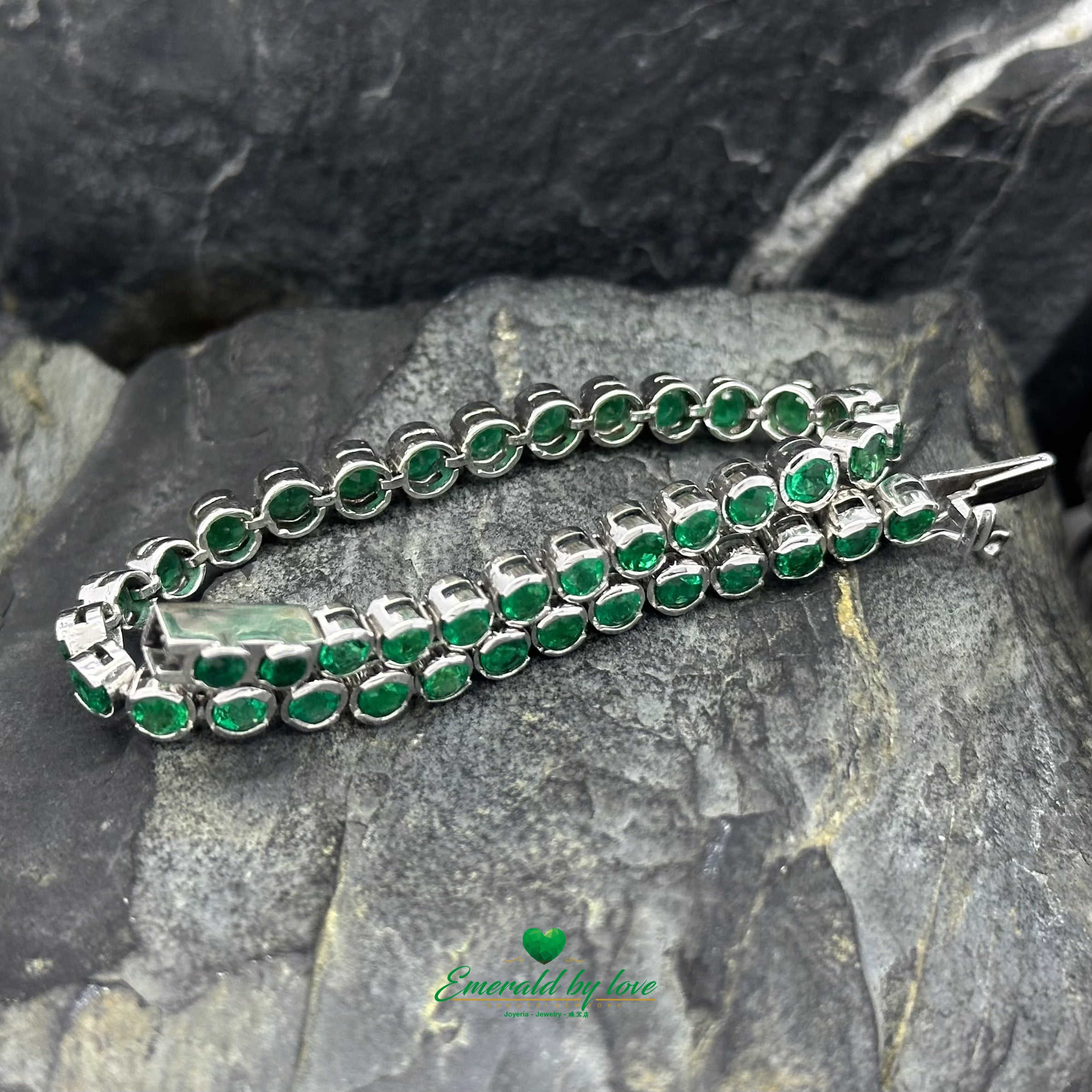 Tennis Bracelet in 18K White Gold with Bezel-Set Round Colombian Emeralds
