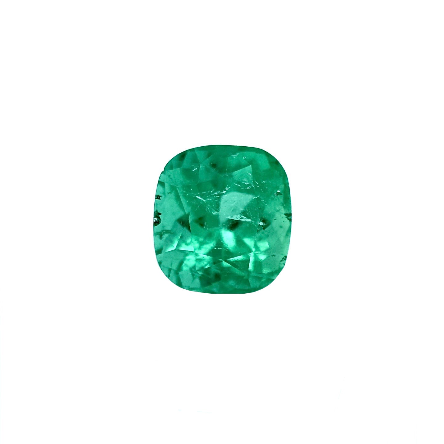 This beautiful 4.96 carat Colombian emerald features a unique oval cushion cut, combining soft curves with elegant proportions. Its rich, well-defined green tone enhances the natural beauty of the gemstone, giving it a vibrant and luxurious presence.
