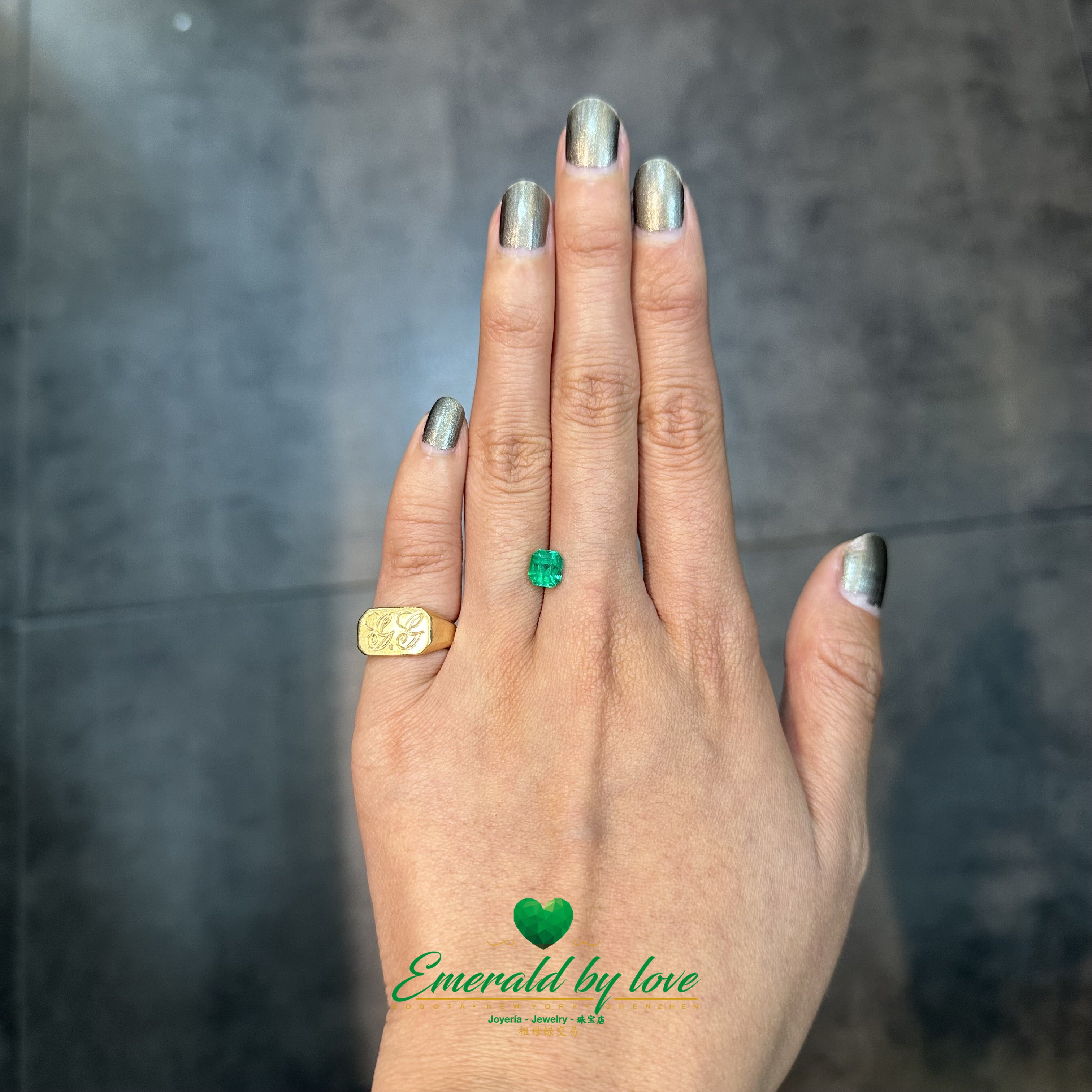 1.02 carat Colombian emerald with polished emerald cut and vibrant green color