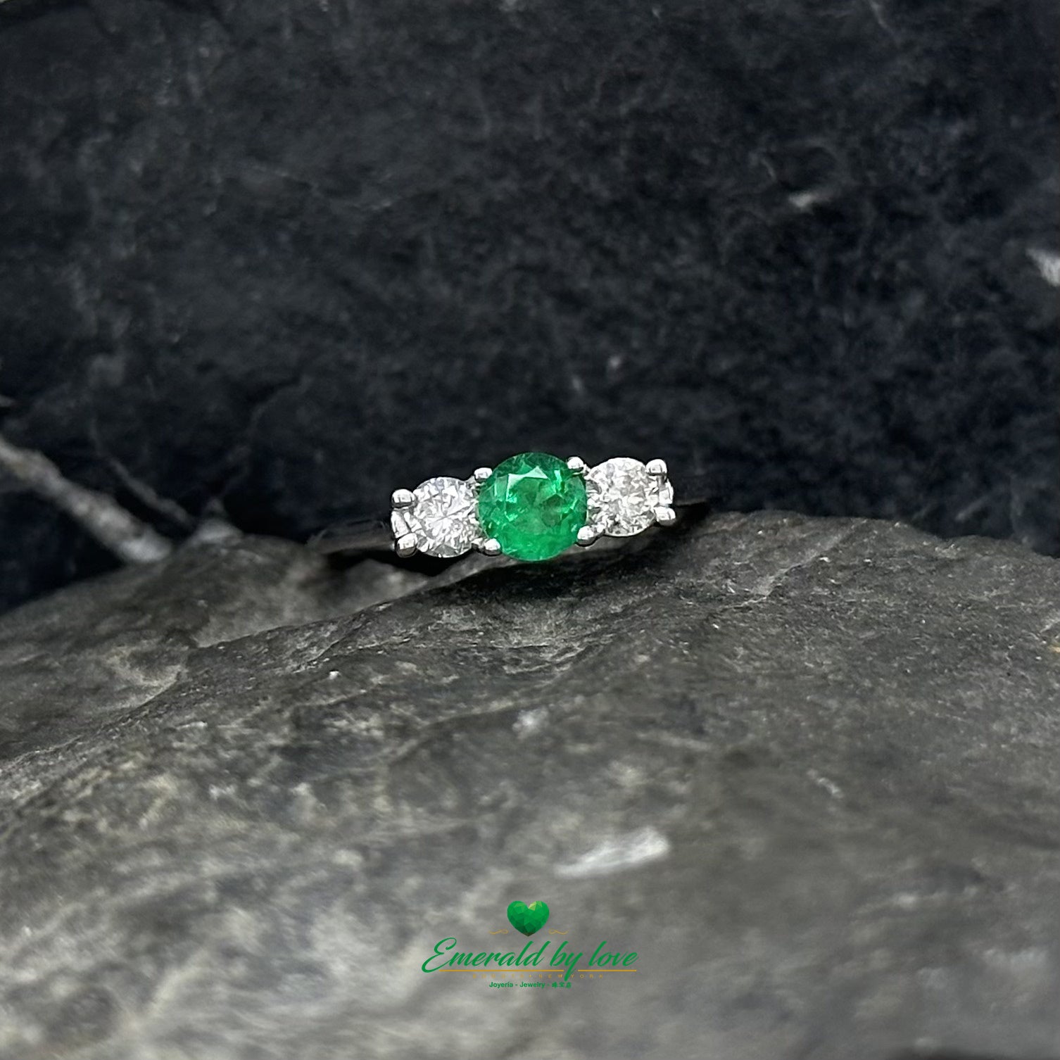 Discover timeless style with this round emerald and diamond accent ring in gold.