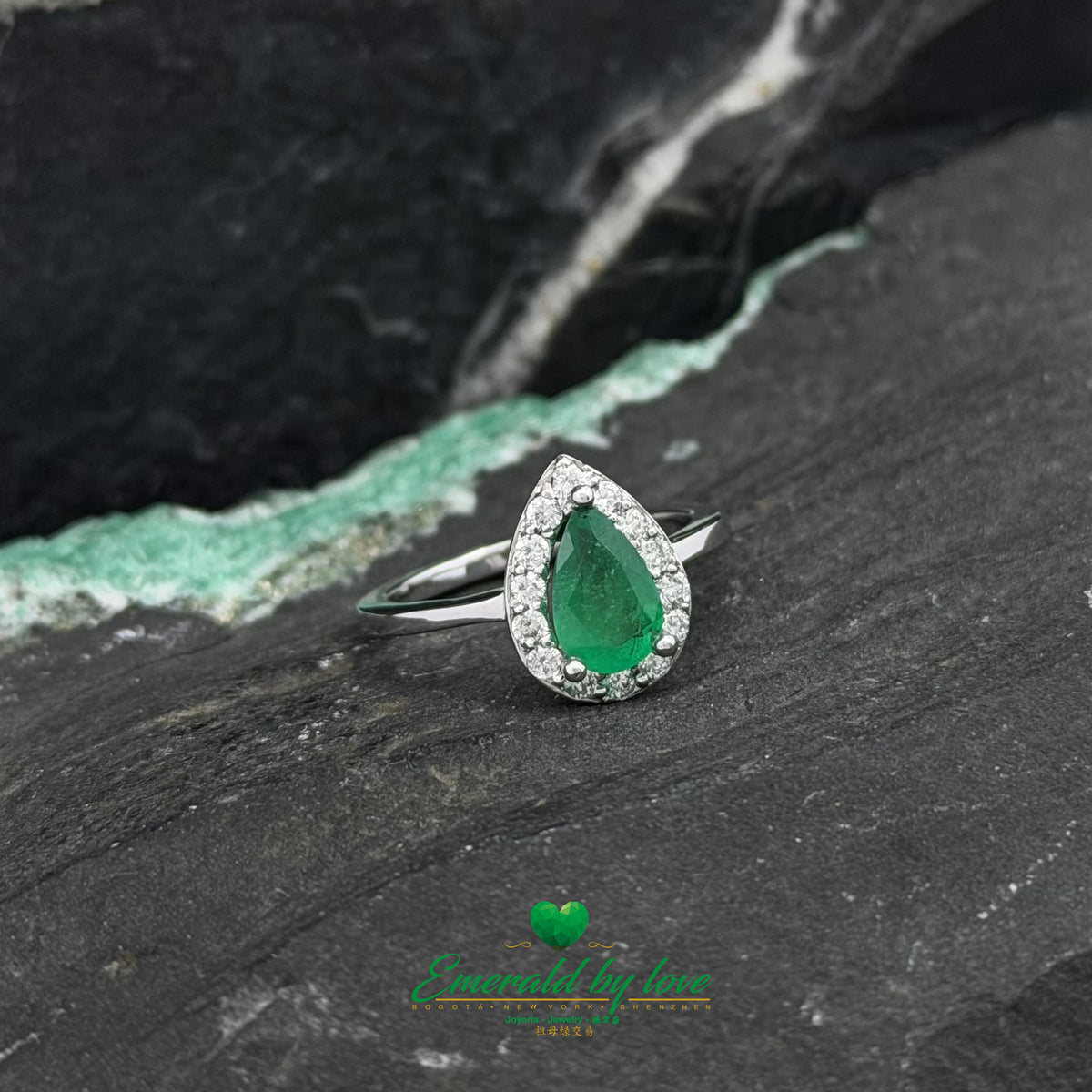 Colombian Emerald Ring with Pear-Cut Center and Diamonds