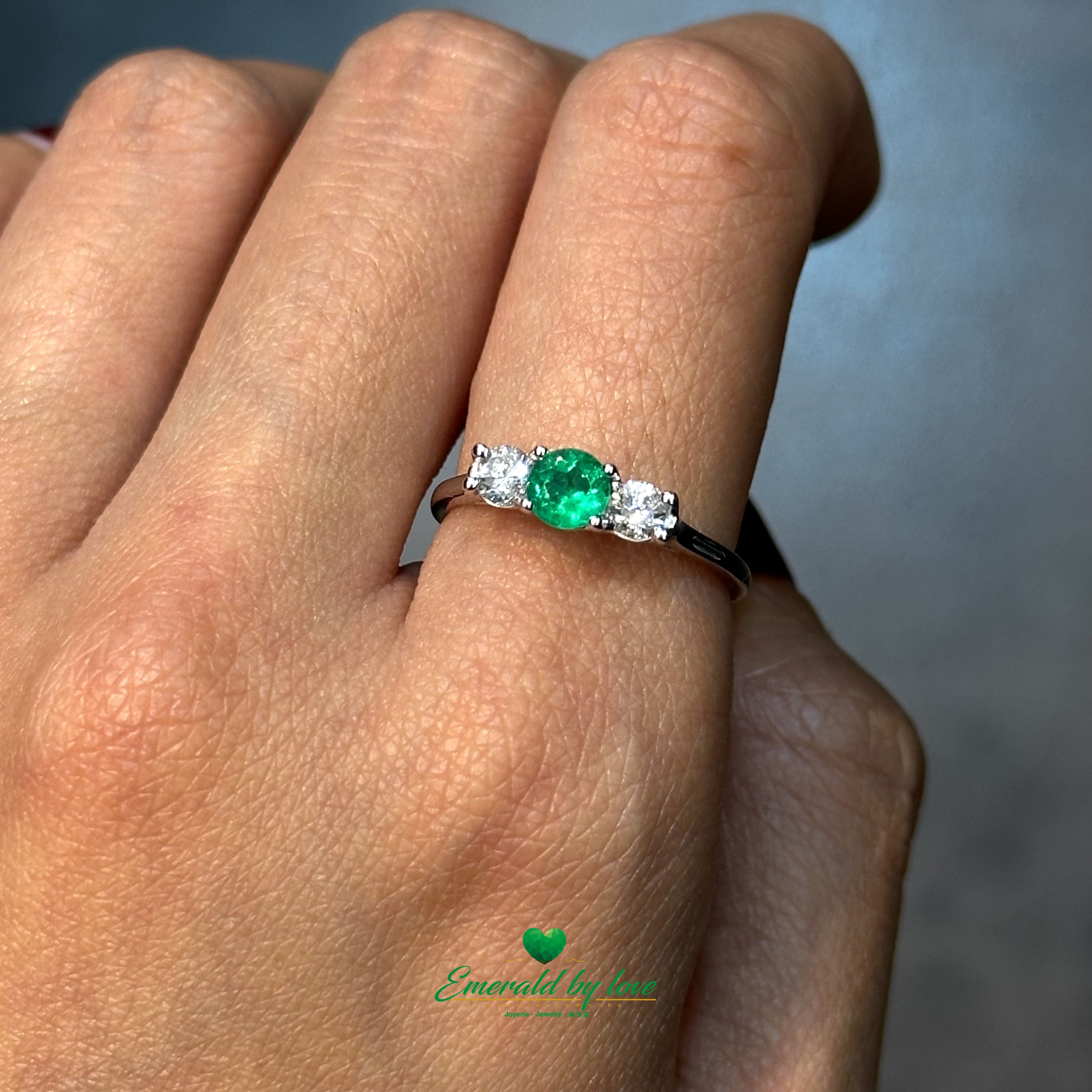Sophisticated ring highlights a deep green emerald and diamonds.