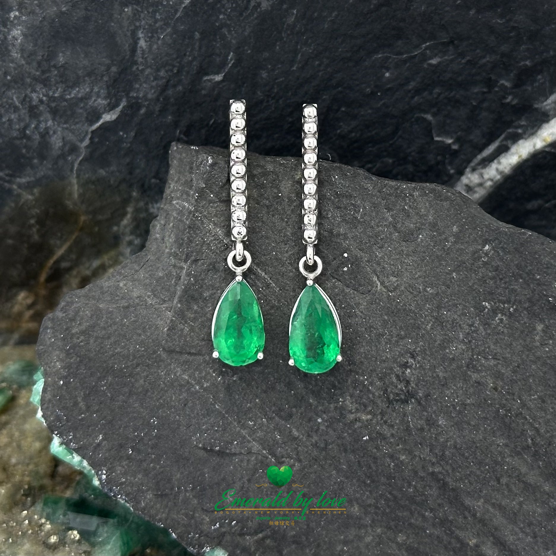 White Gold Serenity: Teardrop Emerald Earrings with Lengthwise Texture