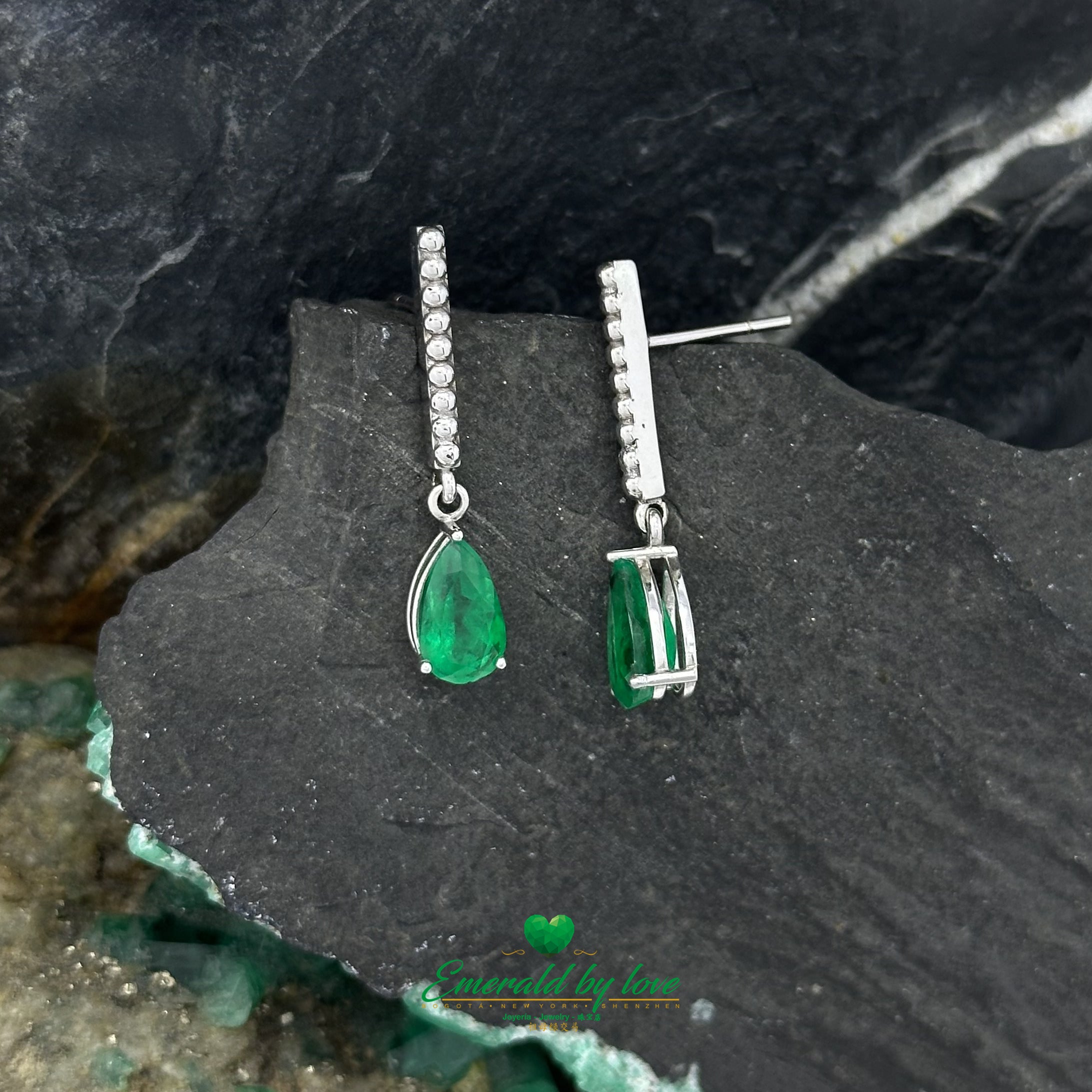 White Gold Serenity: Teardrop Emerald Earrings with Lengthwise Texture