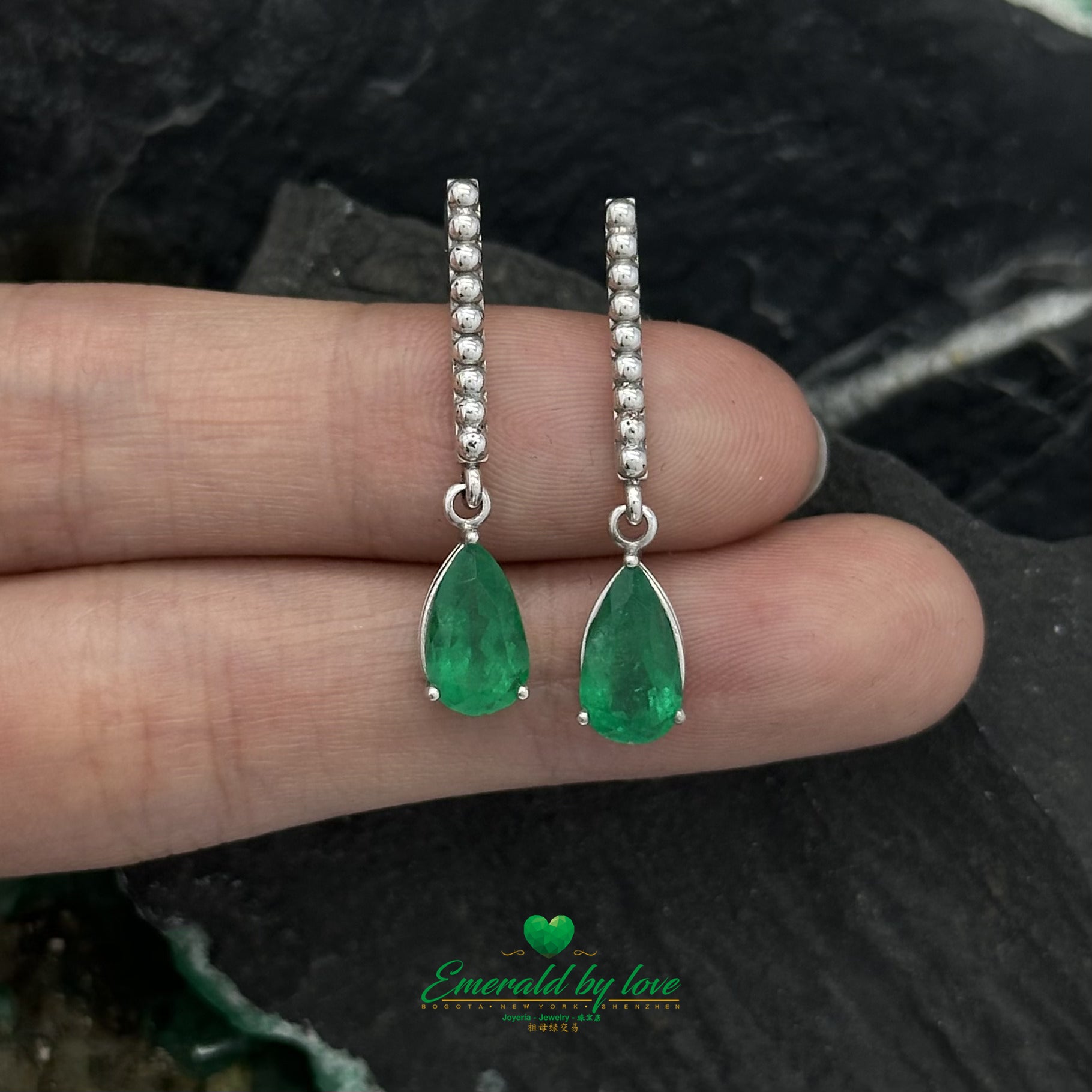 White Gold Serenity: Teardrop Emerald Earrings with Lengthwise Texture