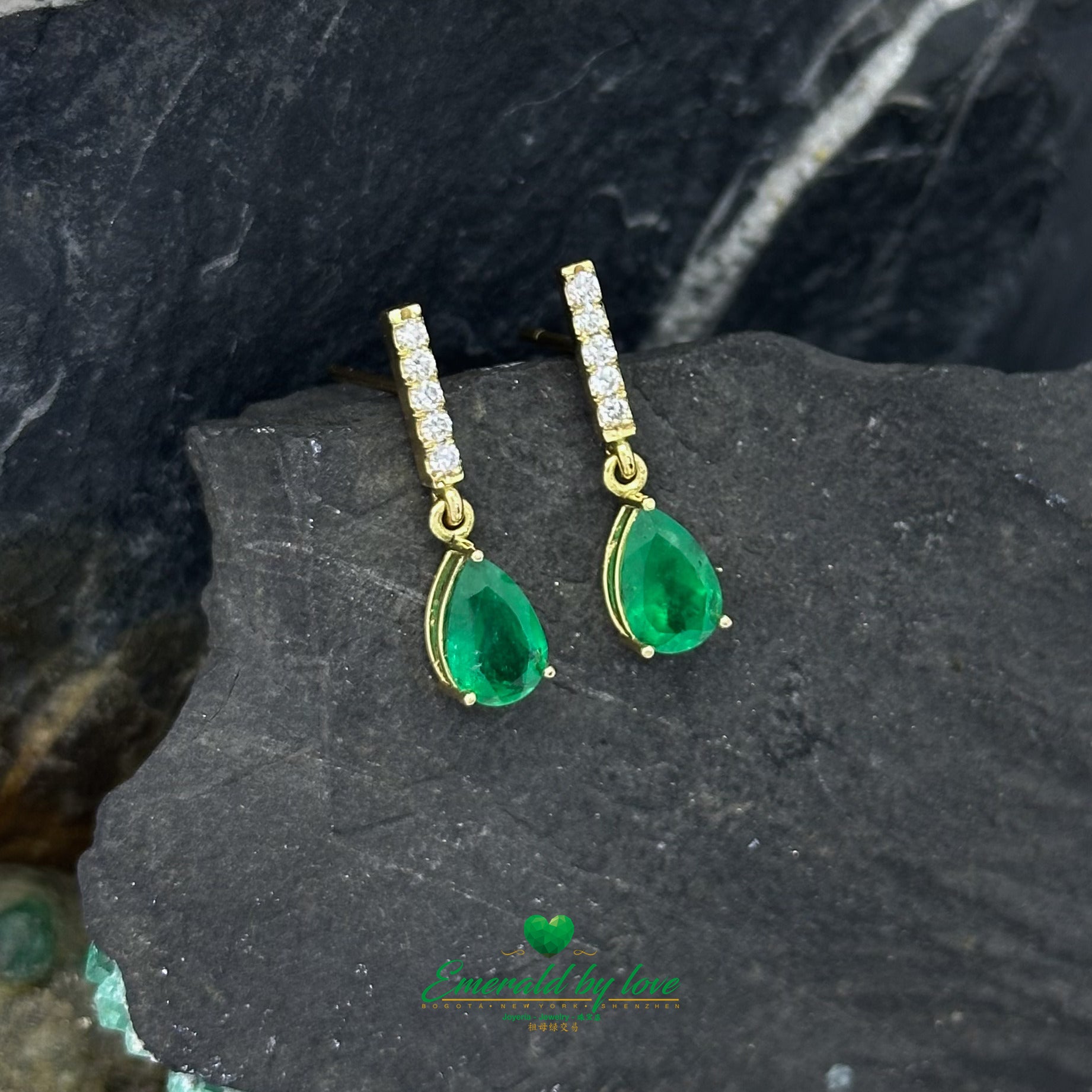 Elongated Yellow Gold Earrings Adorned with Diamond and Emerald Teardrop Accents