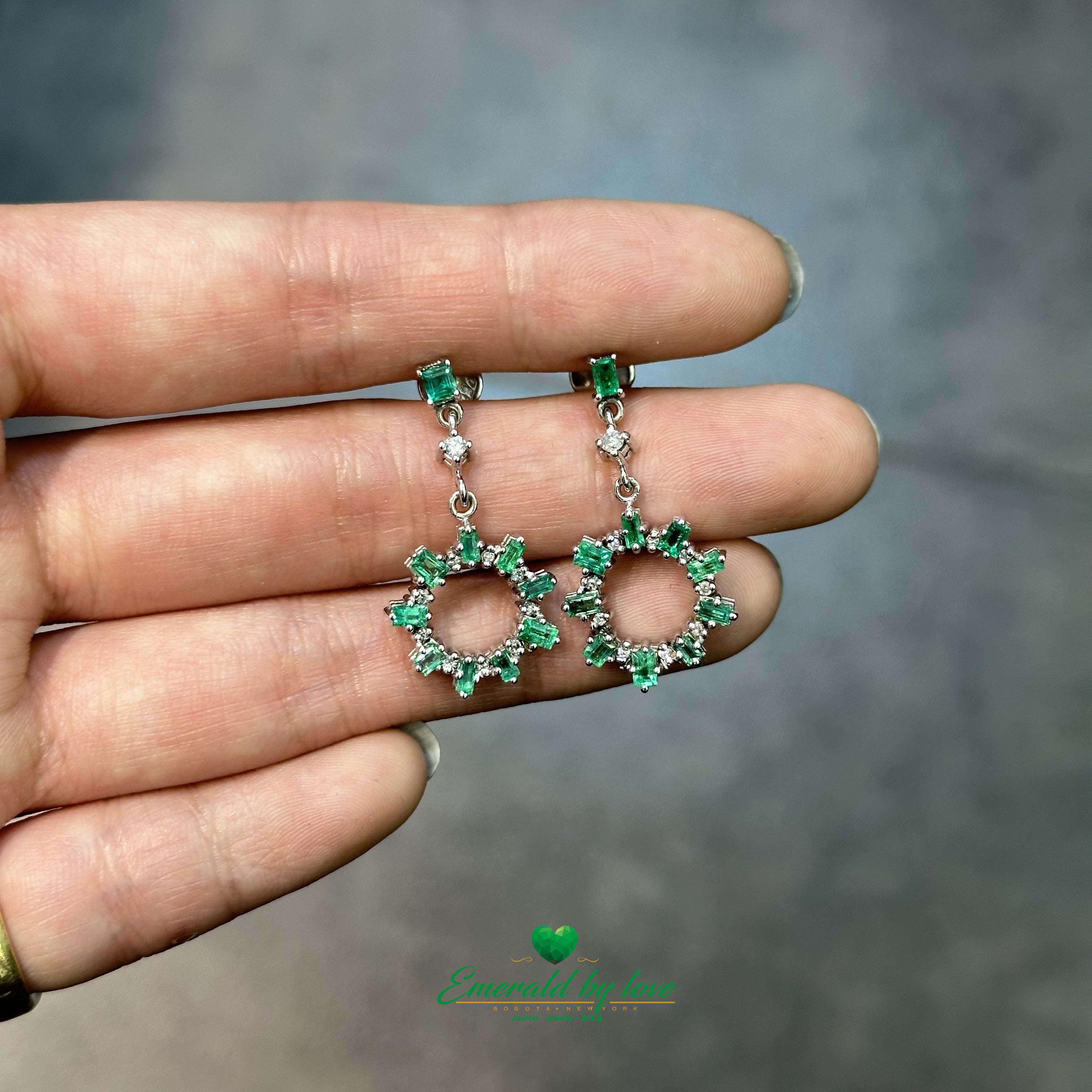 Elongated Earrings in White Gold with Baguette Emeralds, Diamonds, and Sunburst Detailing