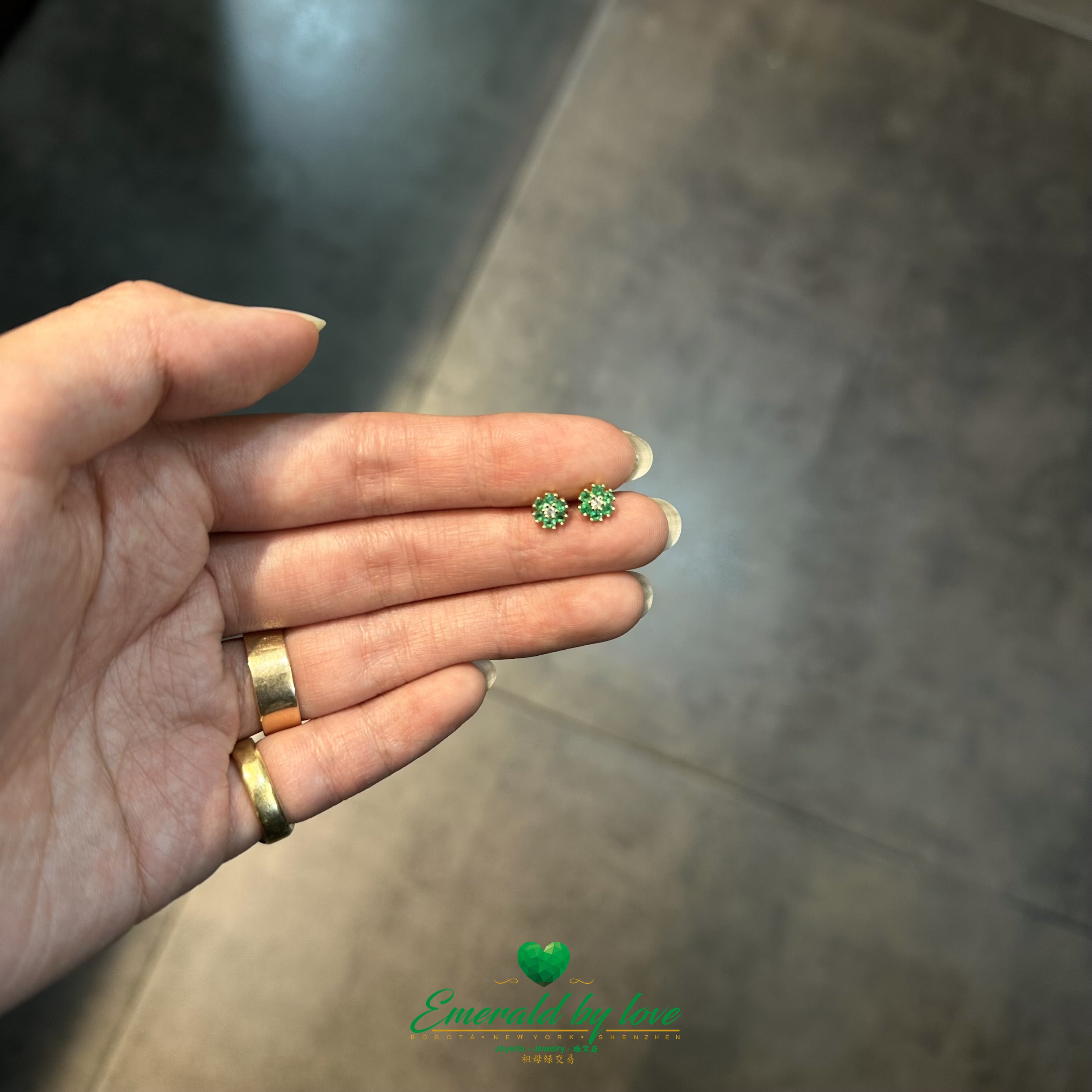 Six-Petal Flower Earrings with Central Diamond and Emerald Petals in 18K Gold
