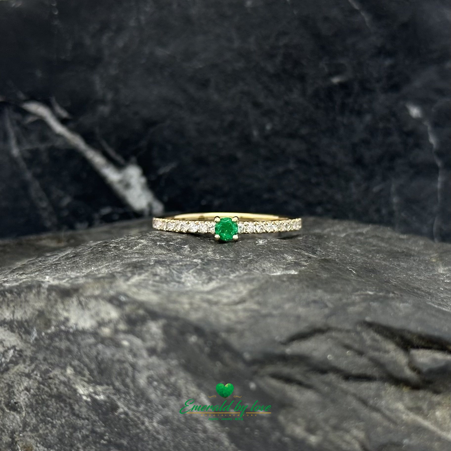 Fine jewelry elegance with a vivid round emerald and a full diamond-set band.