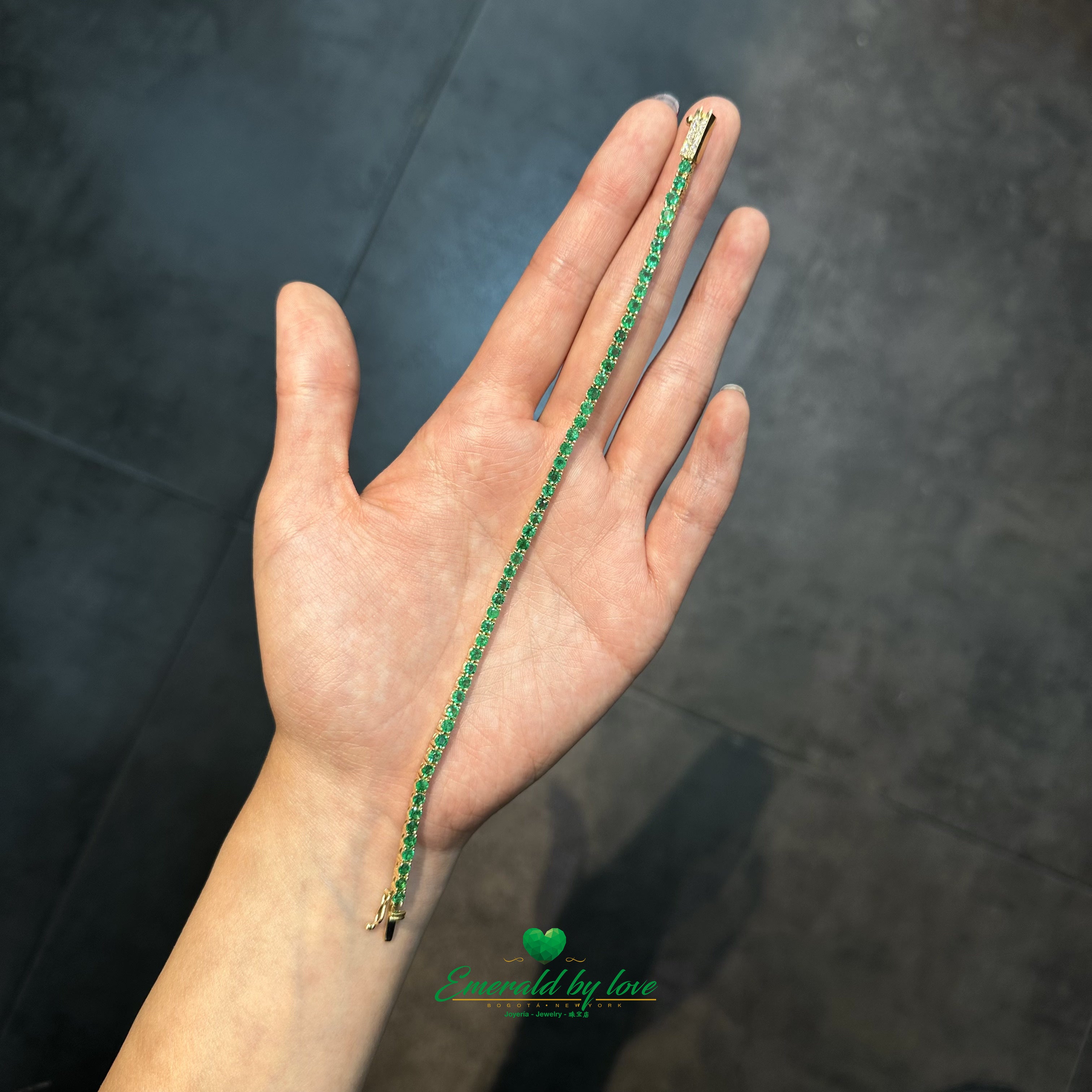 Natural emeralds bezel-set in handcrafted yellow gold bracelet