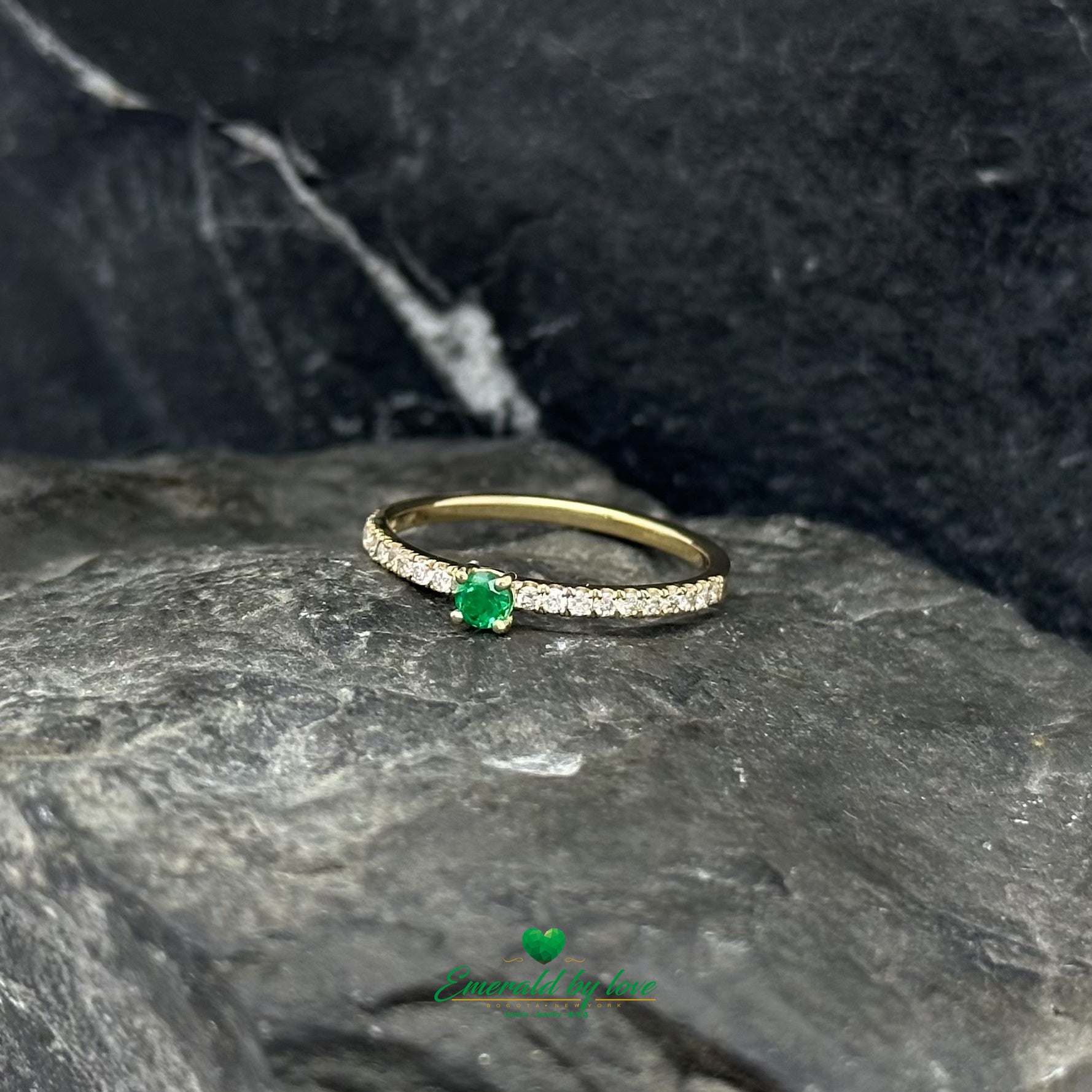Make a bold yet graceful statement with this 18K gold emerald and diamond ring.