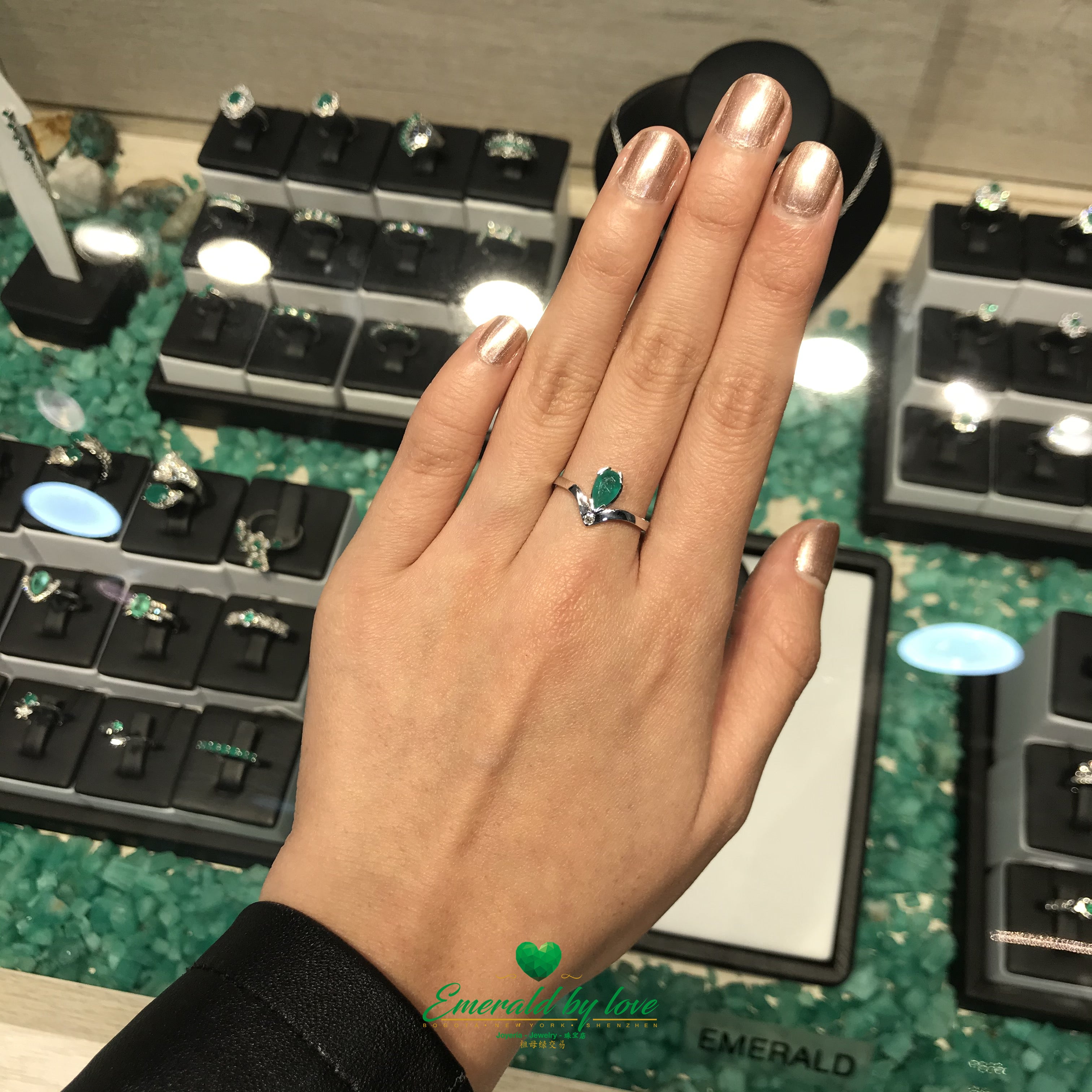 Sleek 18k gold ring with a geometric Colombian emerald centerpiece.