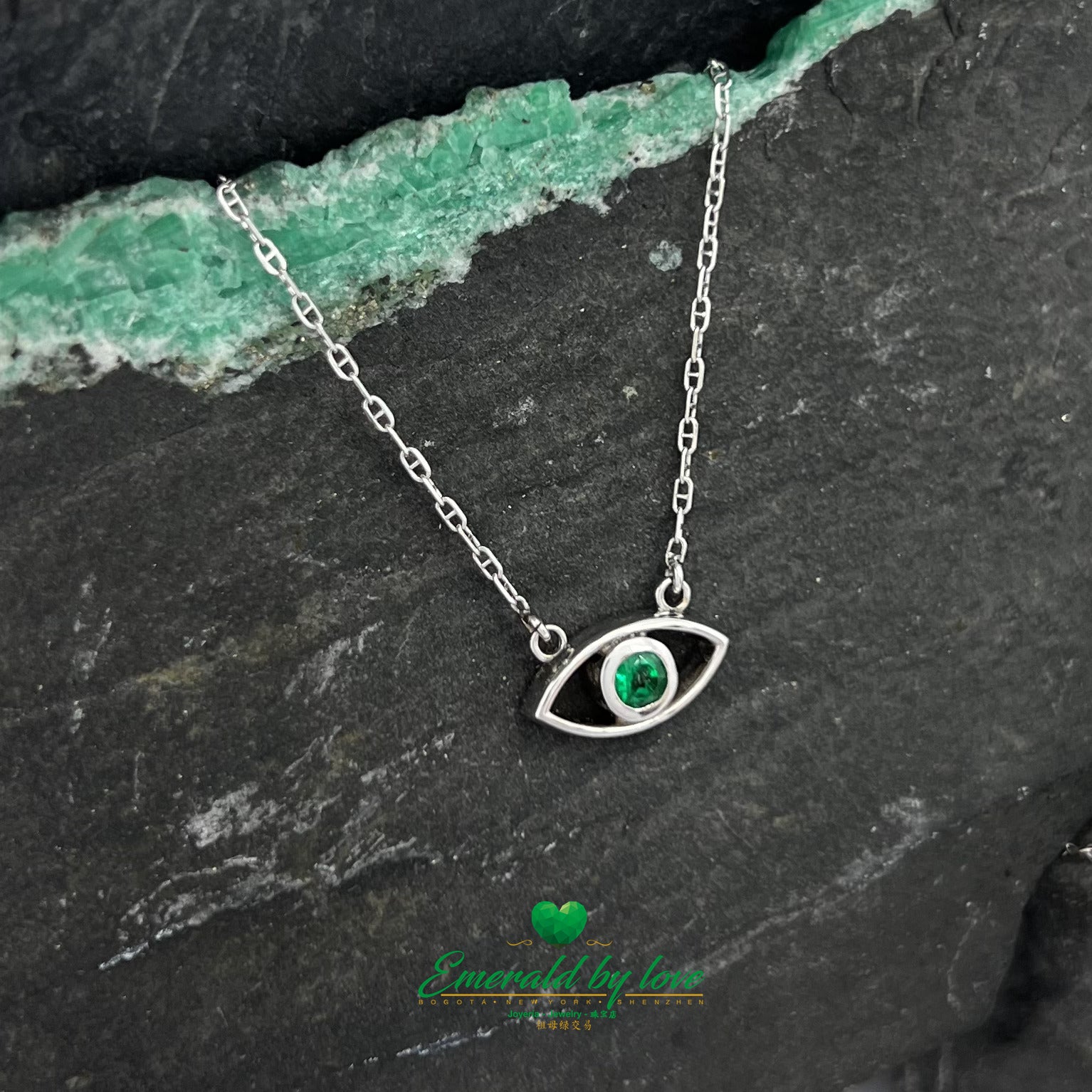 Ethereal Gaze: White Gold Eye Pendant with Round Emerald Center