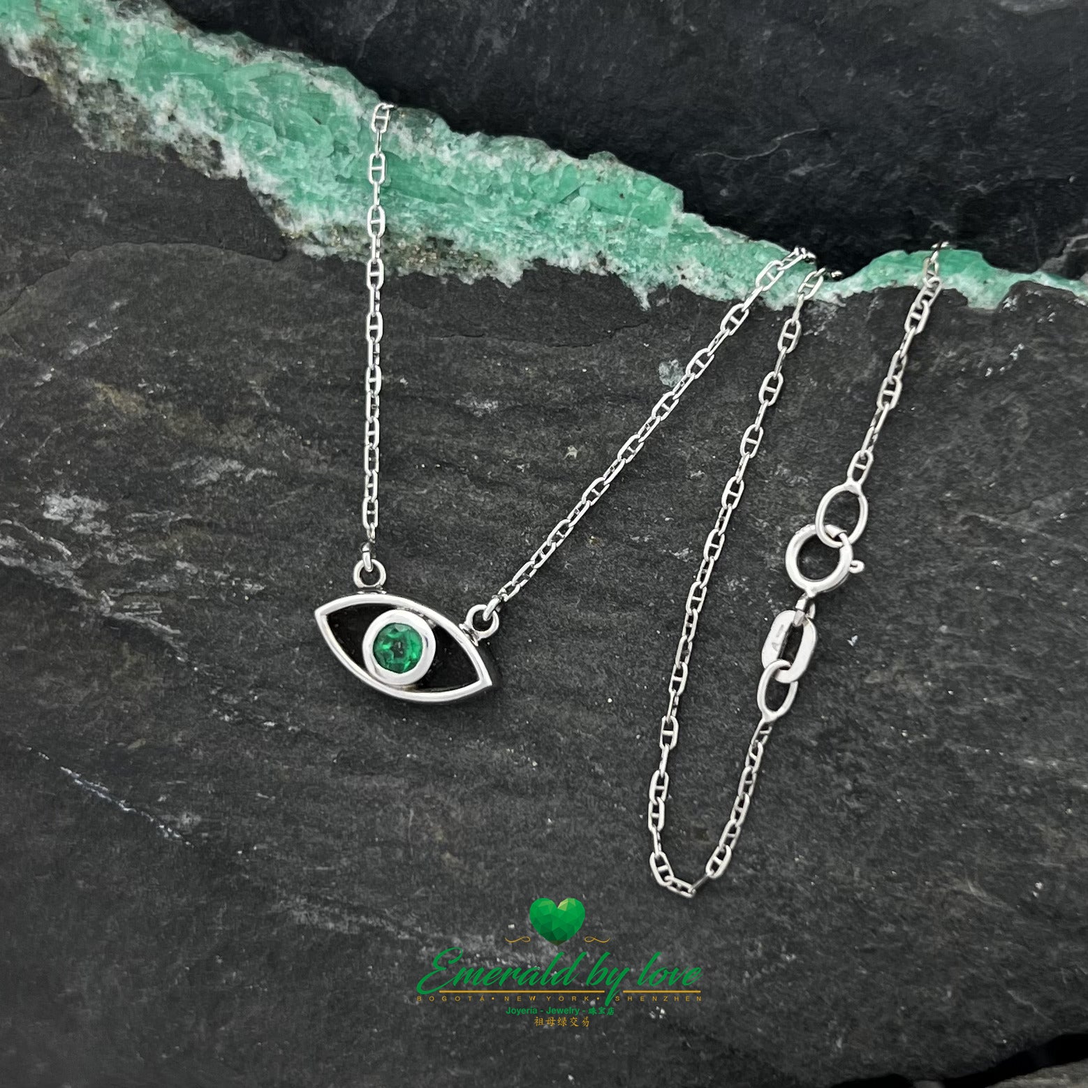 Ethereal Gaze: White Gold Eye Pendant with Round Emerald Center