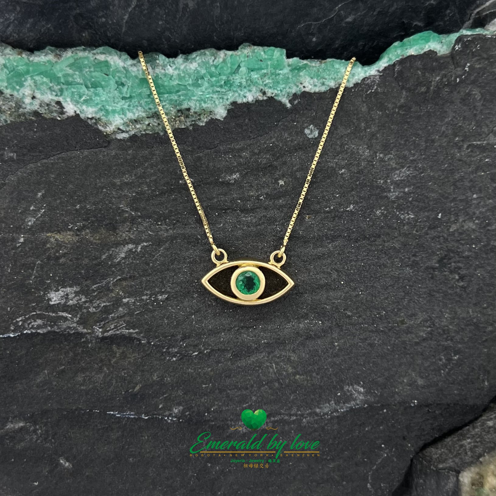 Golden Gaze: Yellow Gold Eye Pendant with Round Emerald Center