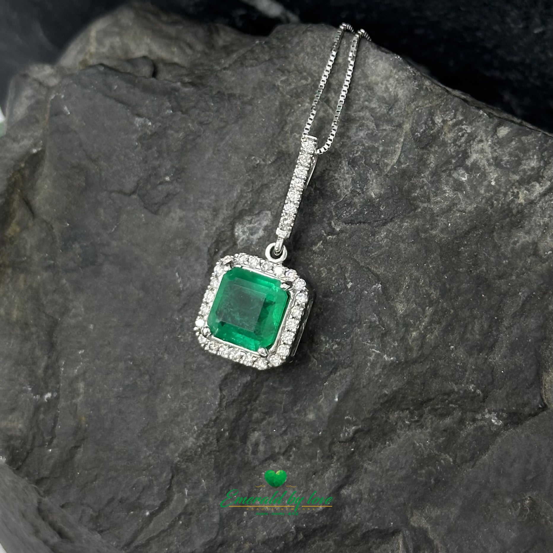 Elegant Emerald-Cut Colombian Emerald Pendant in 18K White Gold with Diamond Halo and Bail Accents