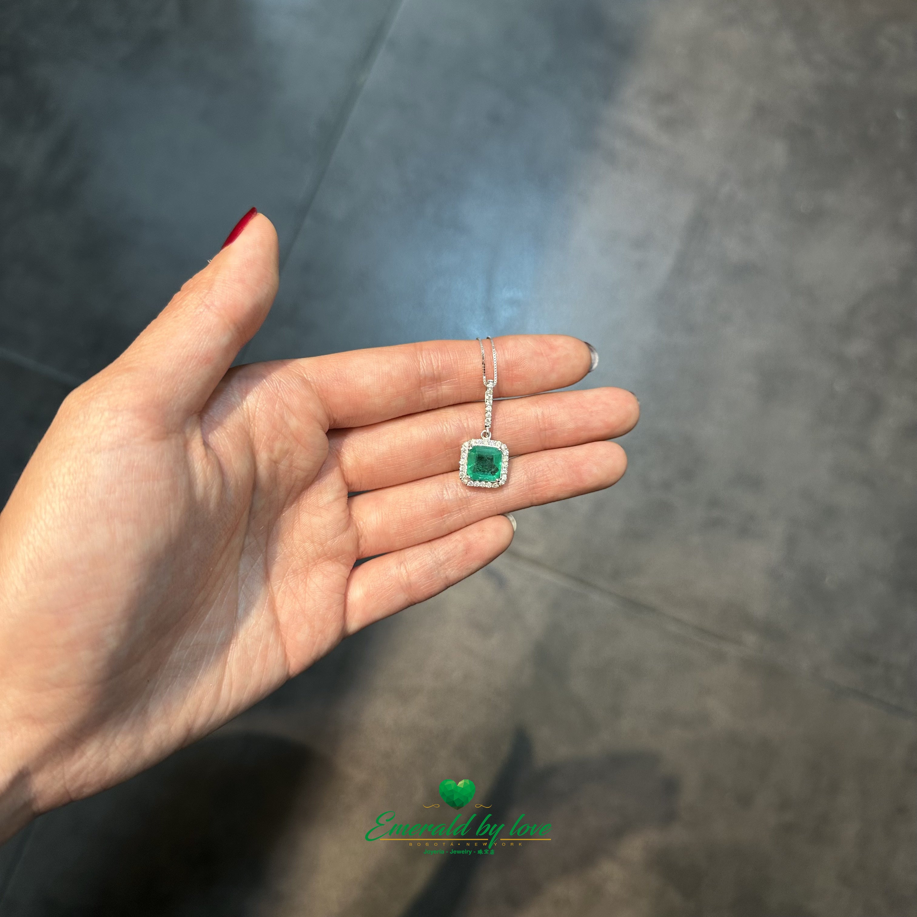 Elegant Emerald-Cut Colombian Emerald Pendant in 18K White Gold with Diamond Halo and Bail Accents