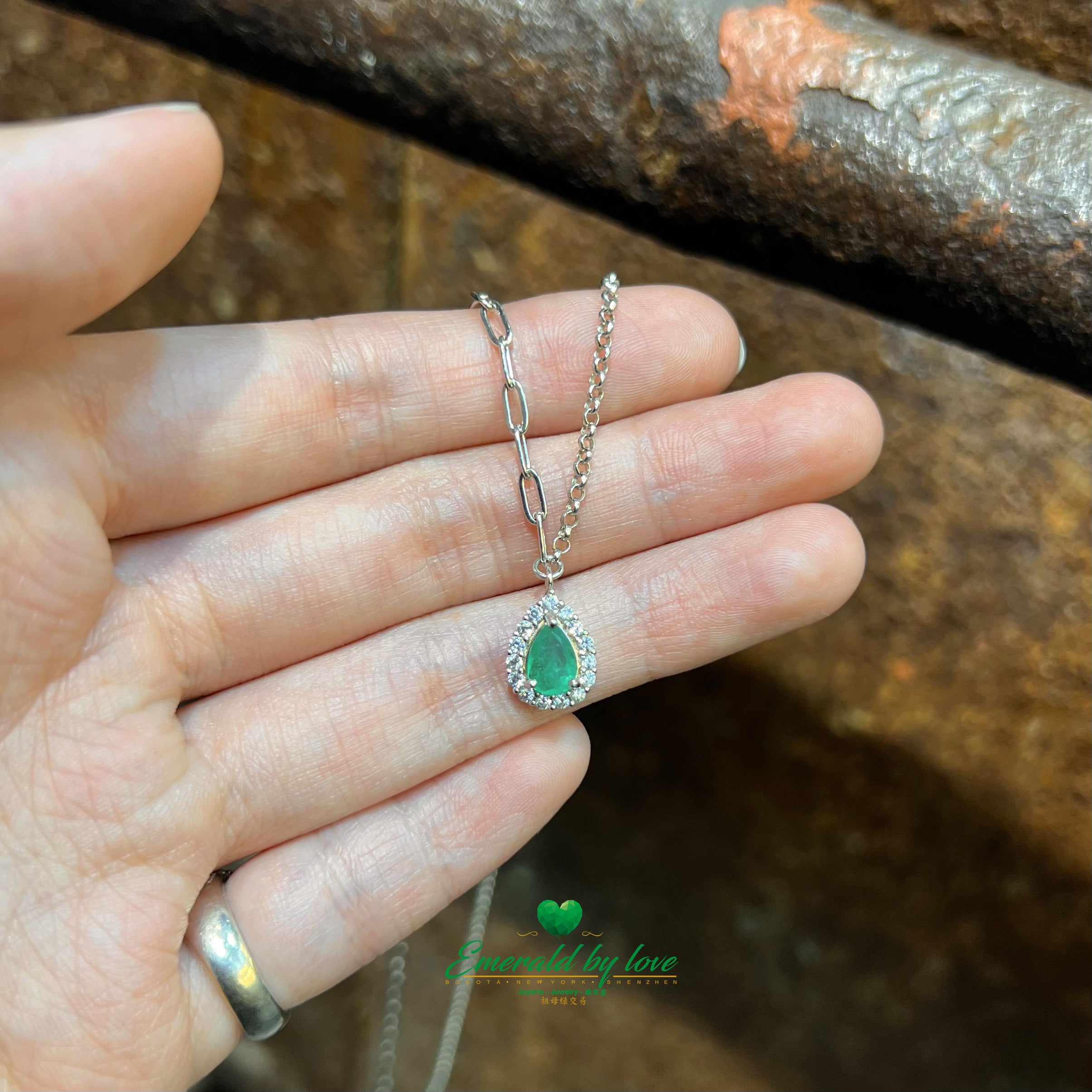 Pear-Shaped Marquise Emerald Pendant with Surrounding Cubic Zirconia and Double Chain