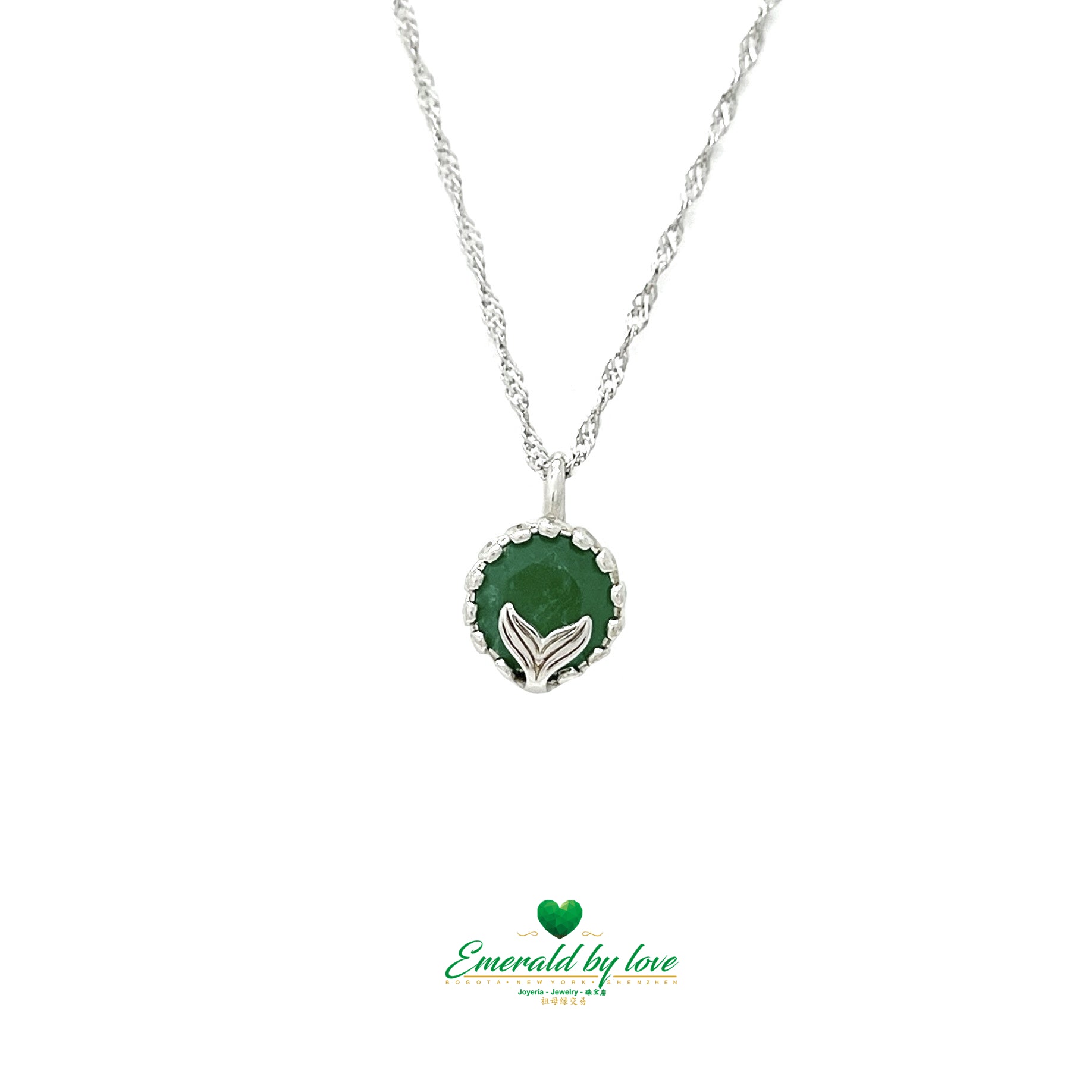 Pendentif rond en émeraude avec arabesques et motif queue de sirène
