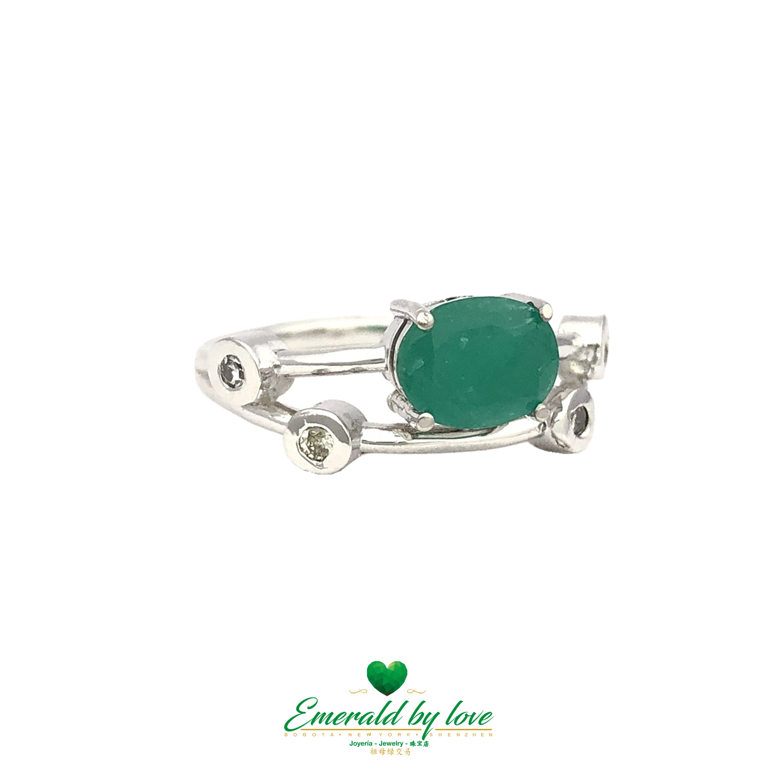 Delicate and petite ring in light 18k gold with a vibrant emerald touch.