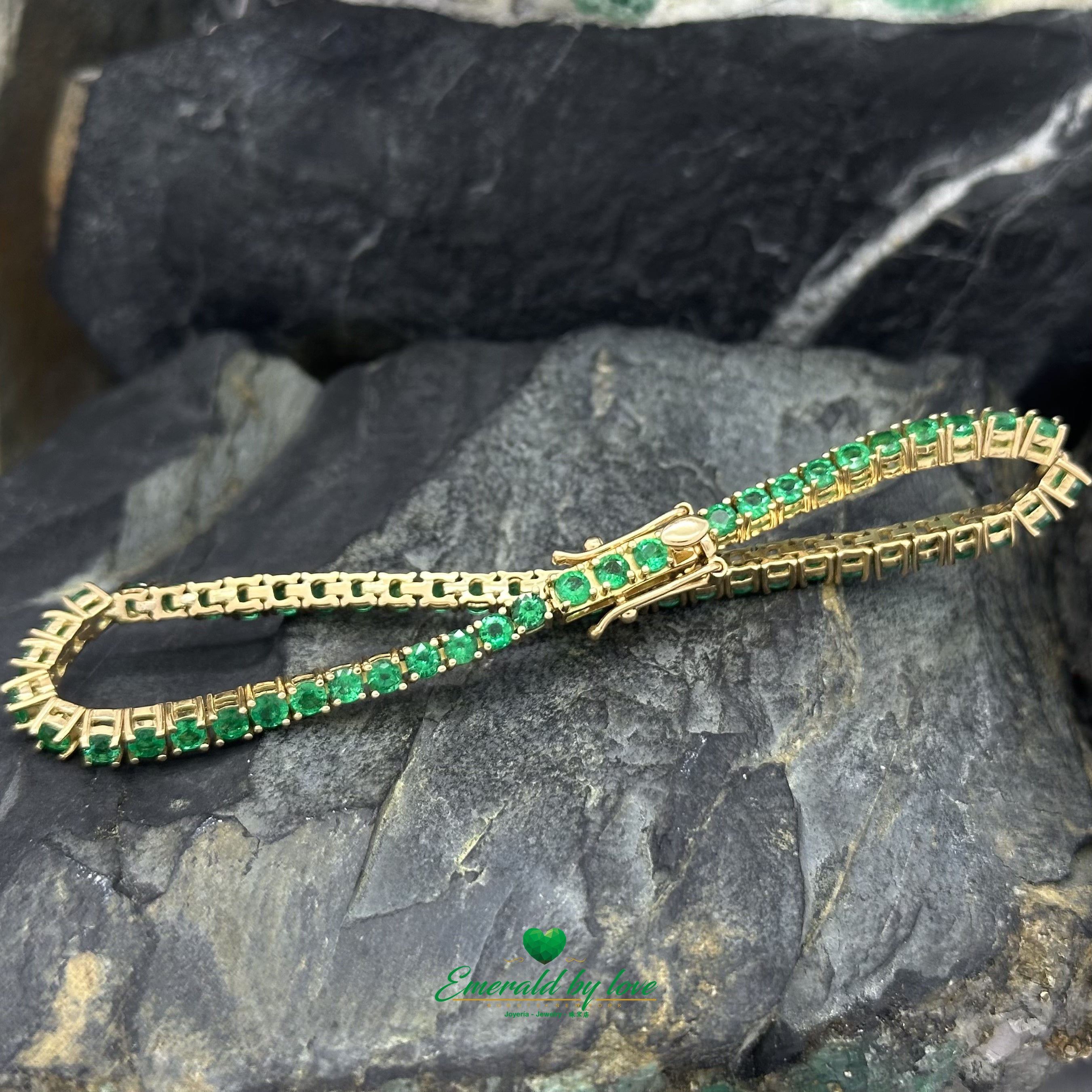 Fine jewelry bracelet featuring natural emeralds in gold setting