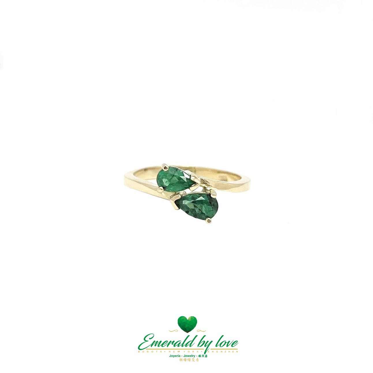 Anillo de oro amarillo dúo con esmeralda en forma de lágrima verde oscuro