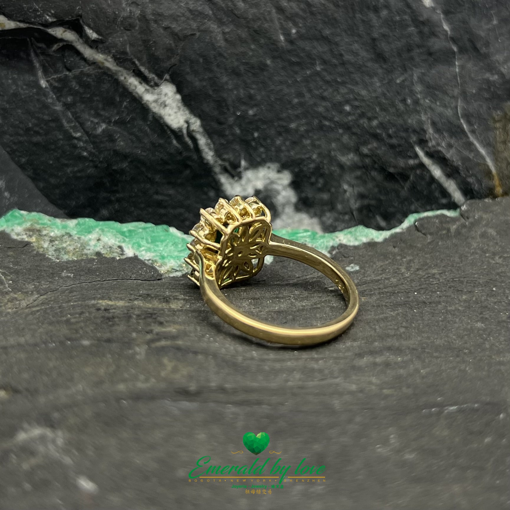 Opulent Luxury Yellow Gold Marquise Ring with Central Colombian Emerald and Diamond Halo
