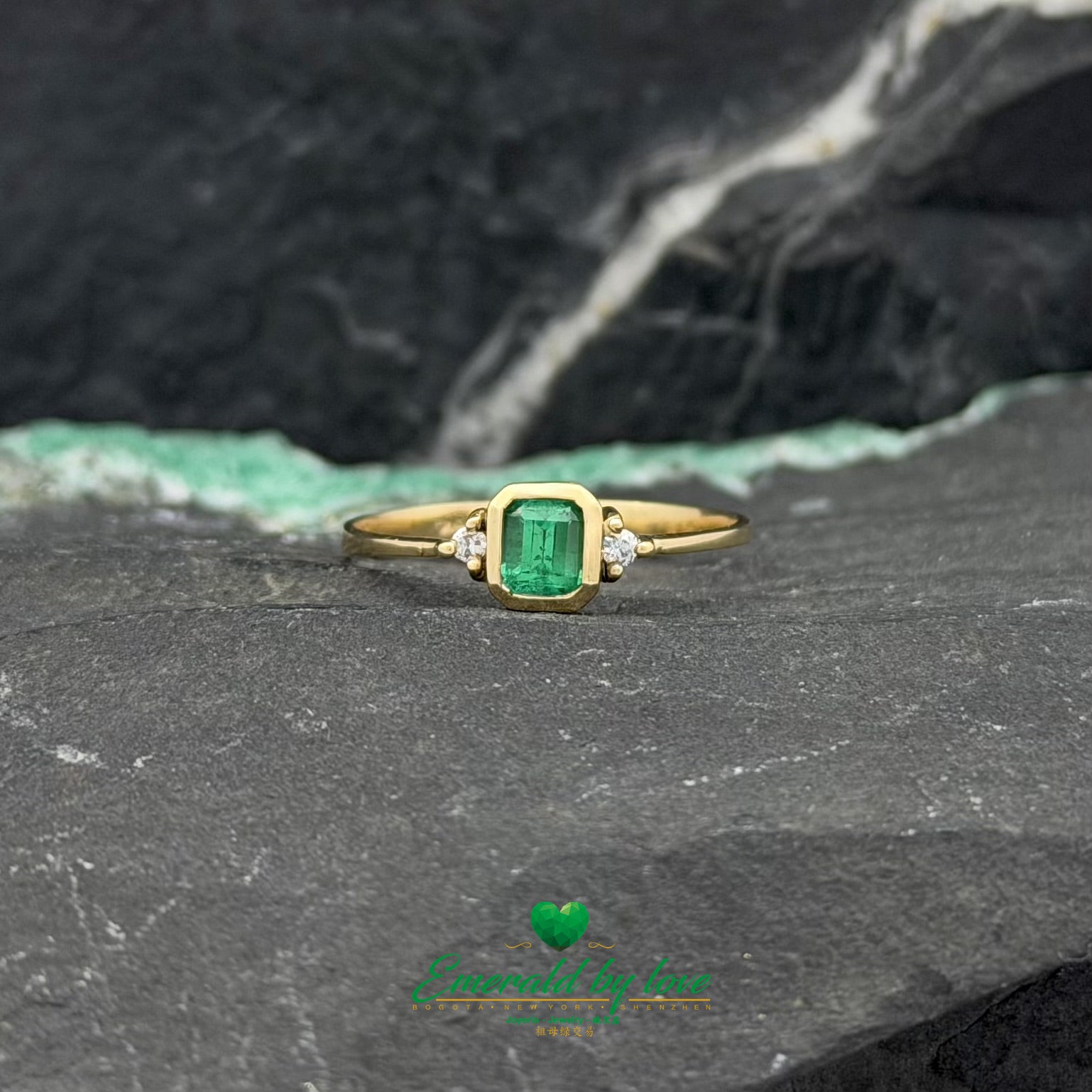Yellow Gold Ring with Bezel-Set Emerald and Side Diamonds