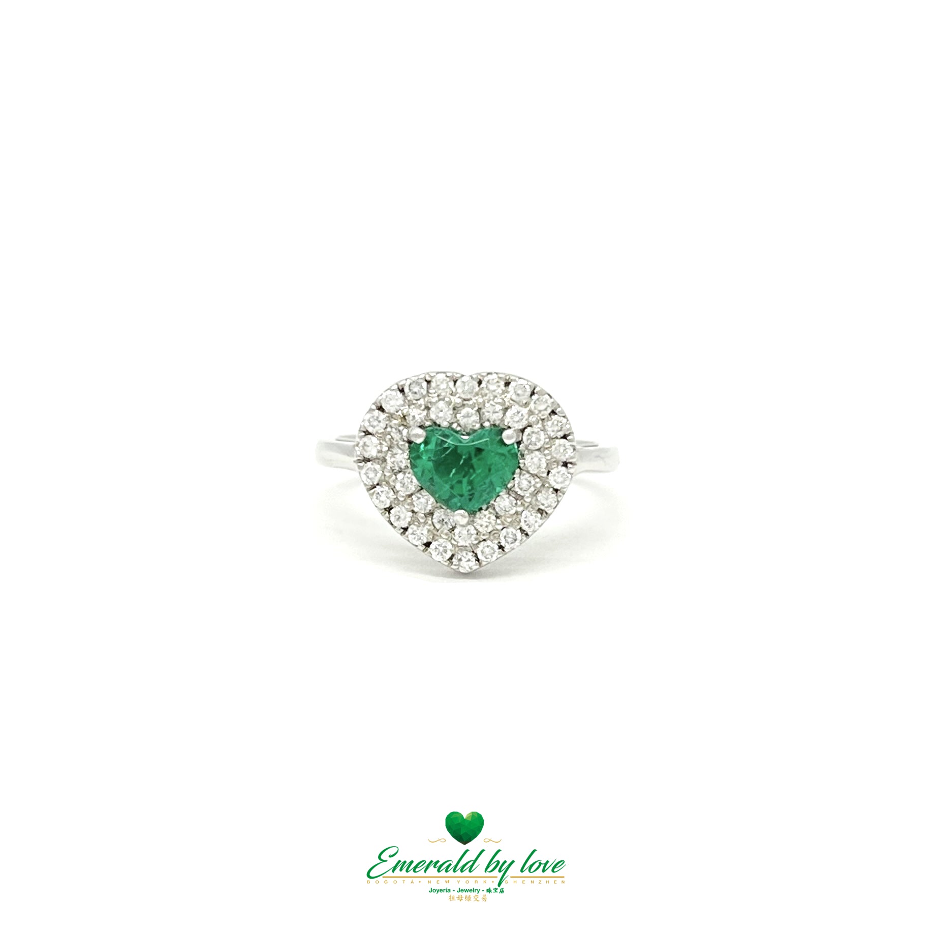 Bague en or blanc avec rangées d'émeraude et de diamants en forme de cœur