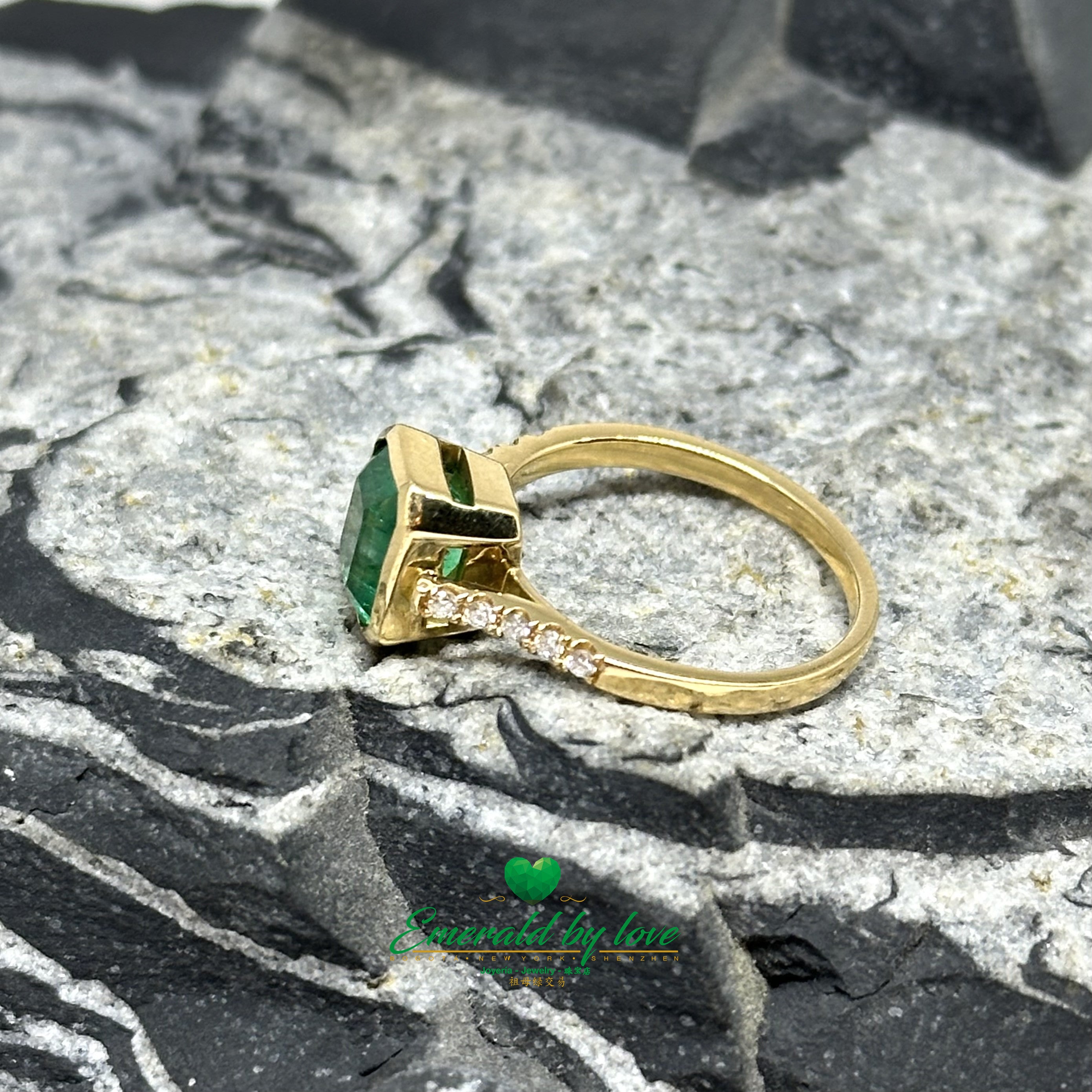 Elegant Bezel-Set Emerald-Cut Emerald Engagement Ring with Diamond Band