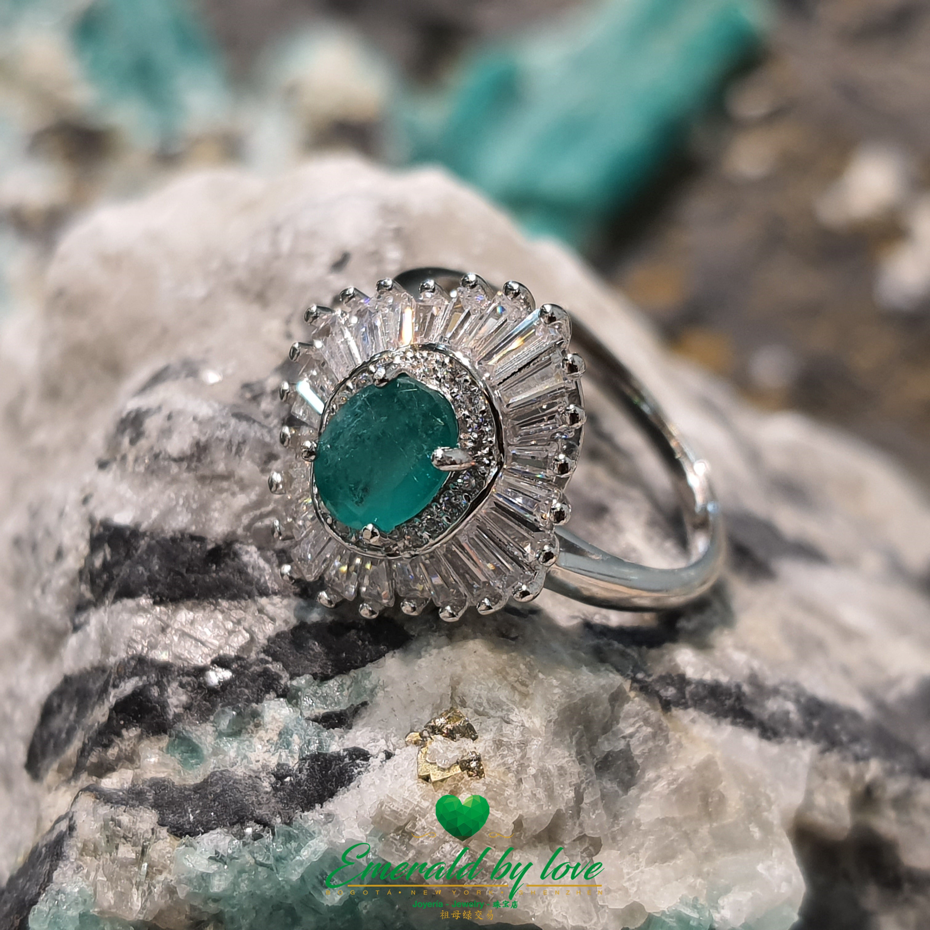 Imperial Marquise Ring with Oval Central Emerald and Baguette CZ Surround: Majestic Elegance