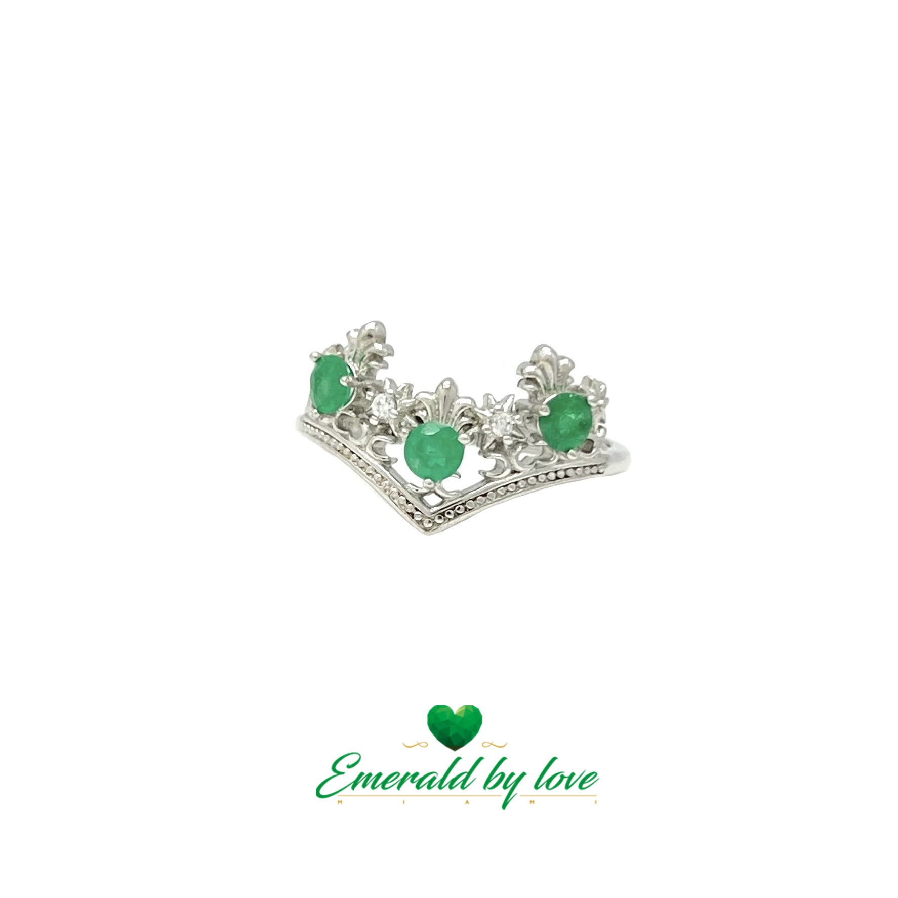 Bague de style couronne avec pointes vers le bas et émeraudes rondes entourées d'arabesques
