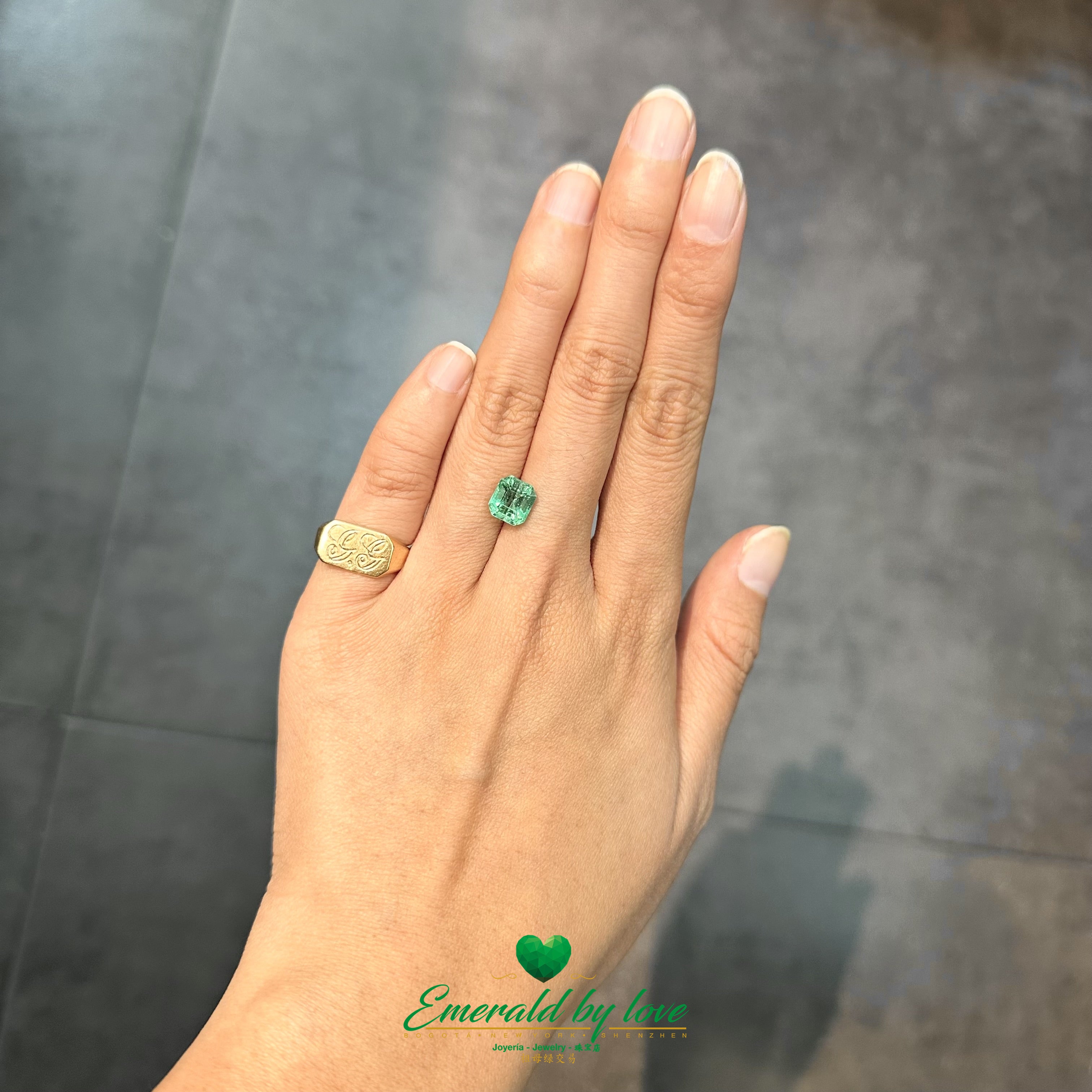 Loose rectangular Colombian emerald with crisp edges and intense green hue