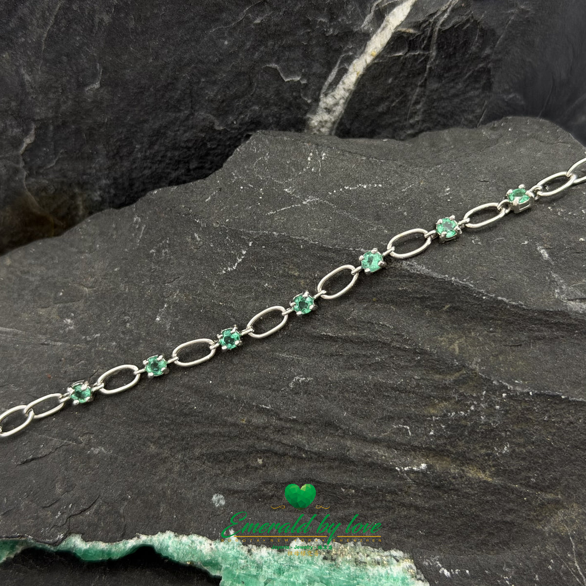 Sterling Silver Bracelet Featuring Round Emeralds and Alternating Disc Links
