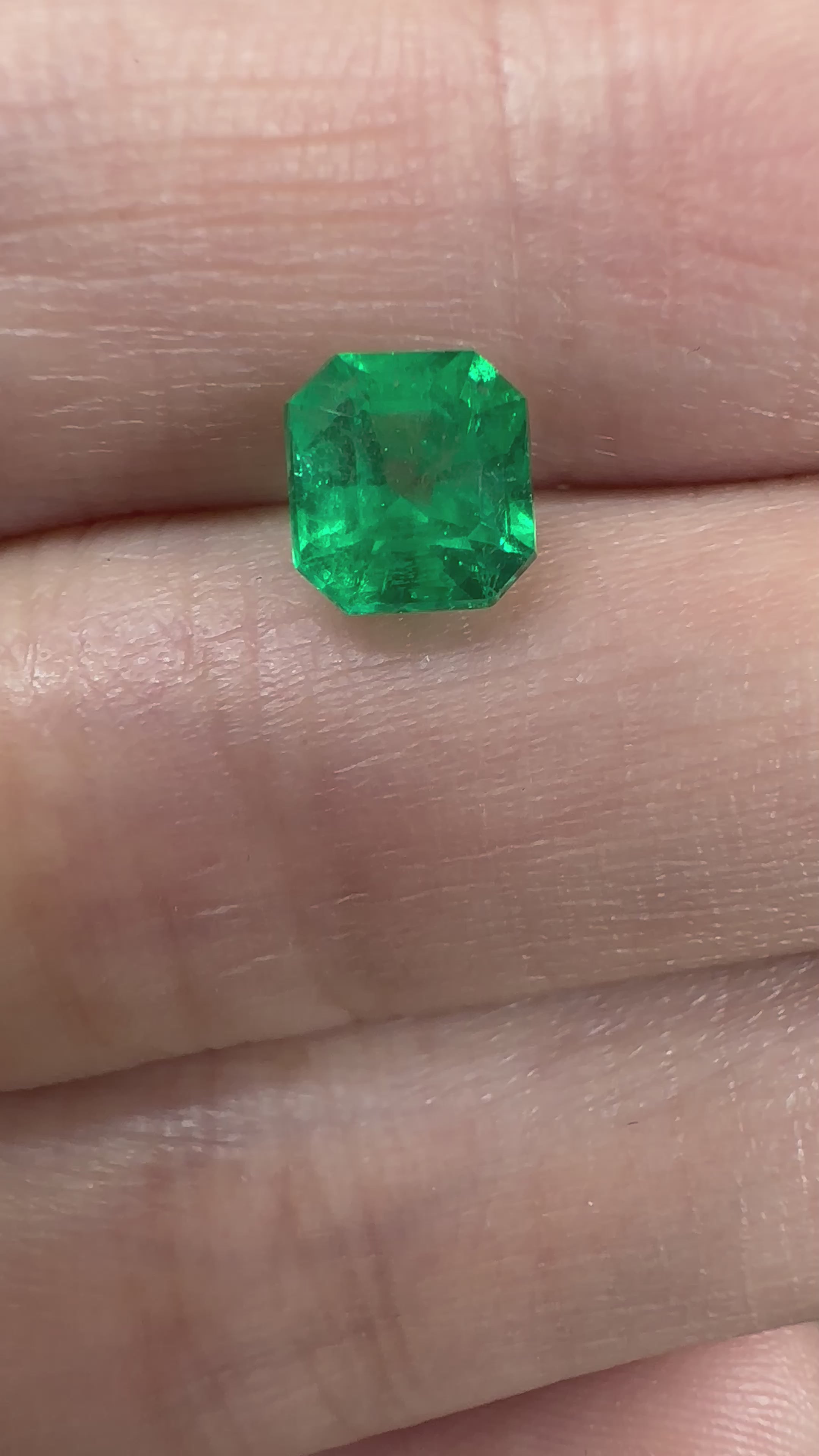 Vivid green Colombian emerald weighing 1.08 carats in square cut with natural inclusions