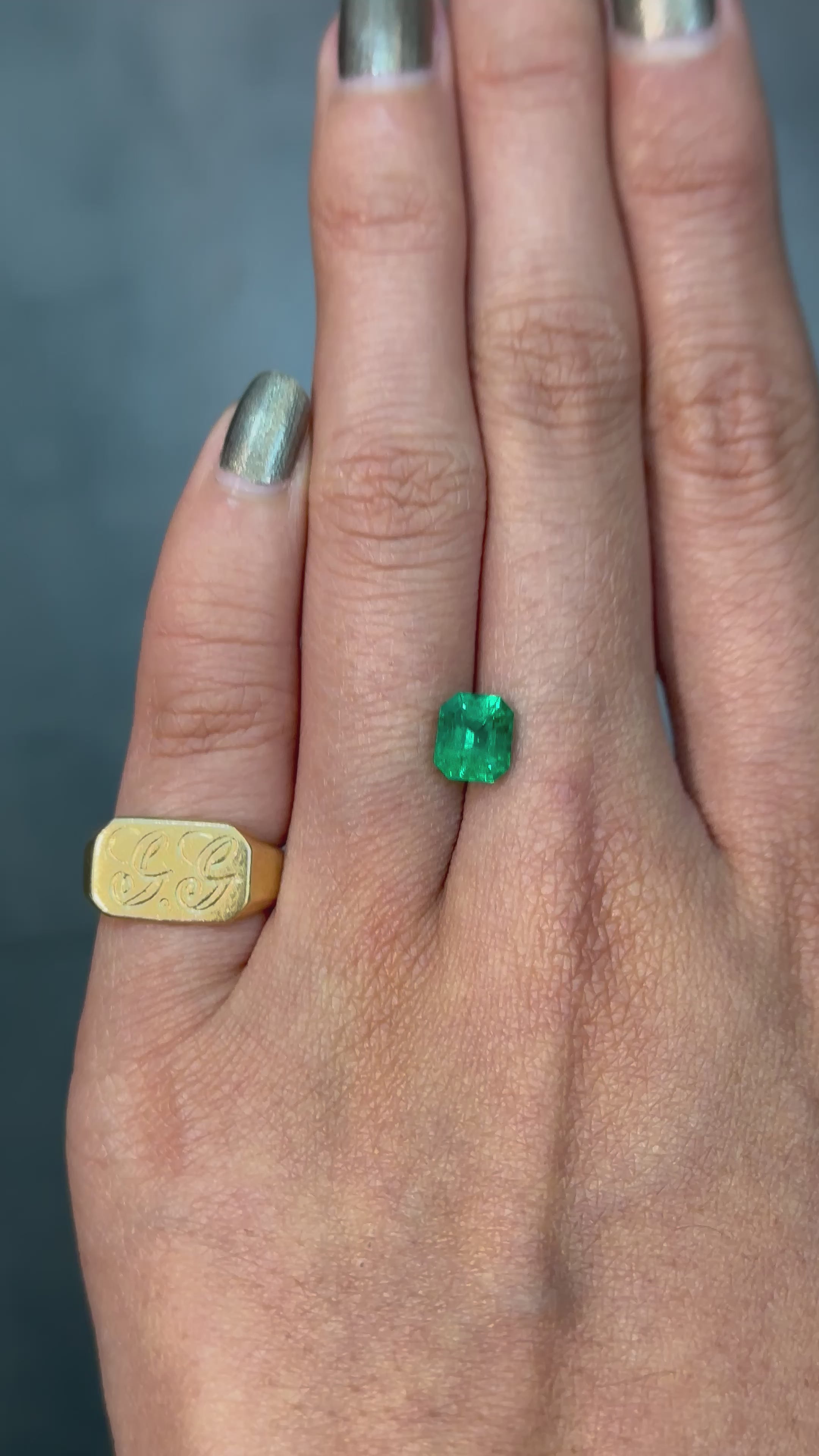 High-quality 1.24 carat emerald-cut Colombian emerald with clean lines and bold green color