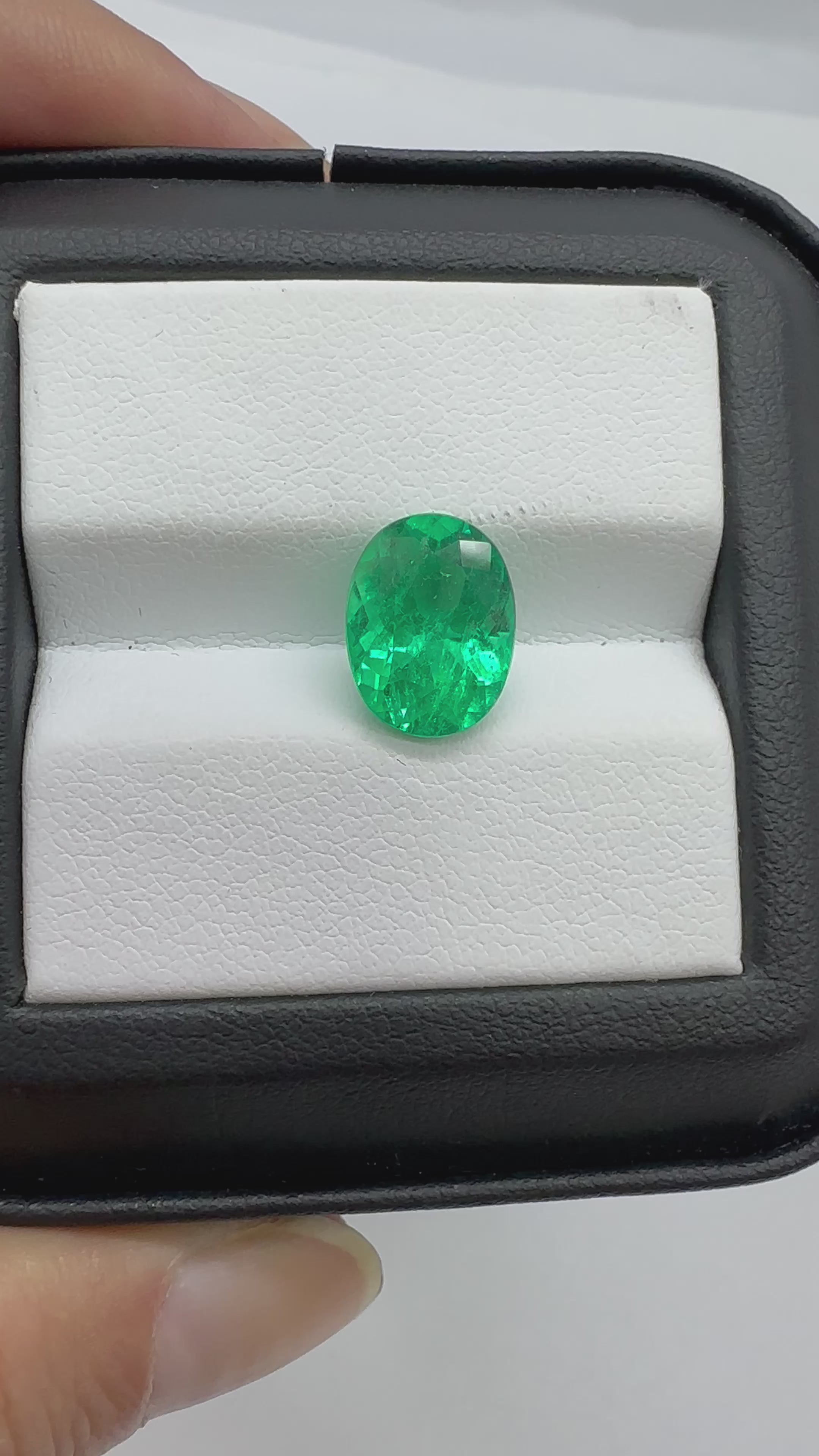 3.45 carat Colombian emerald in oval shape with intense green saturation and glassy appearance