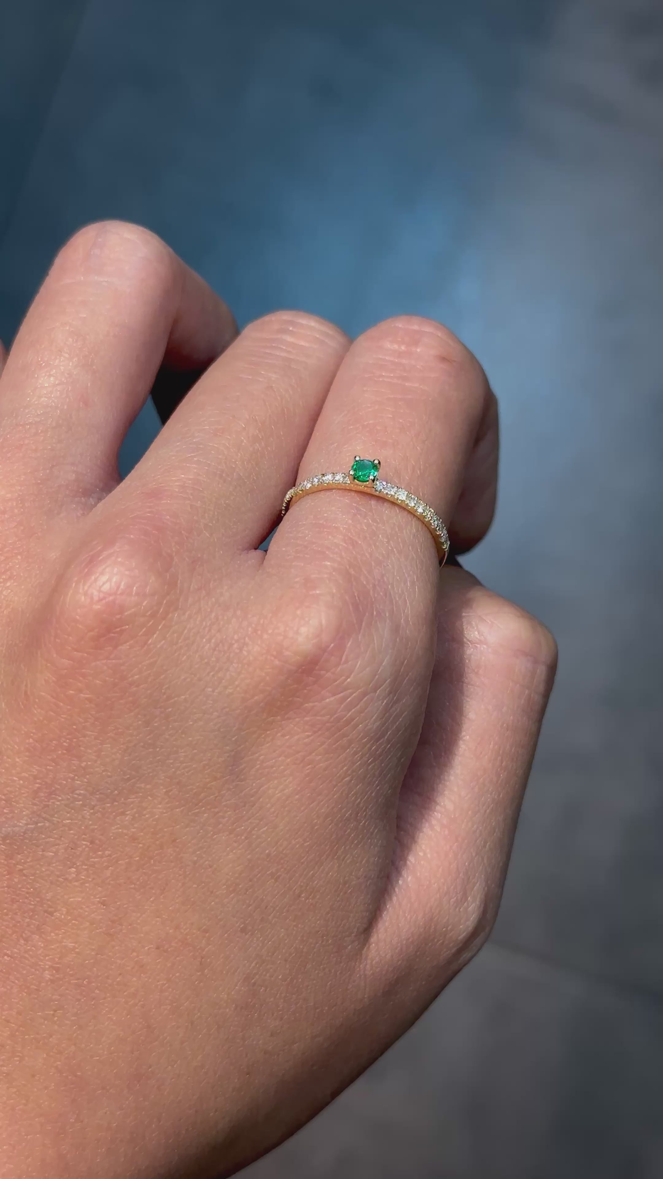 Let your style shine with this round colombian emerald and diamond masterpiece.