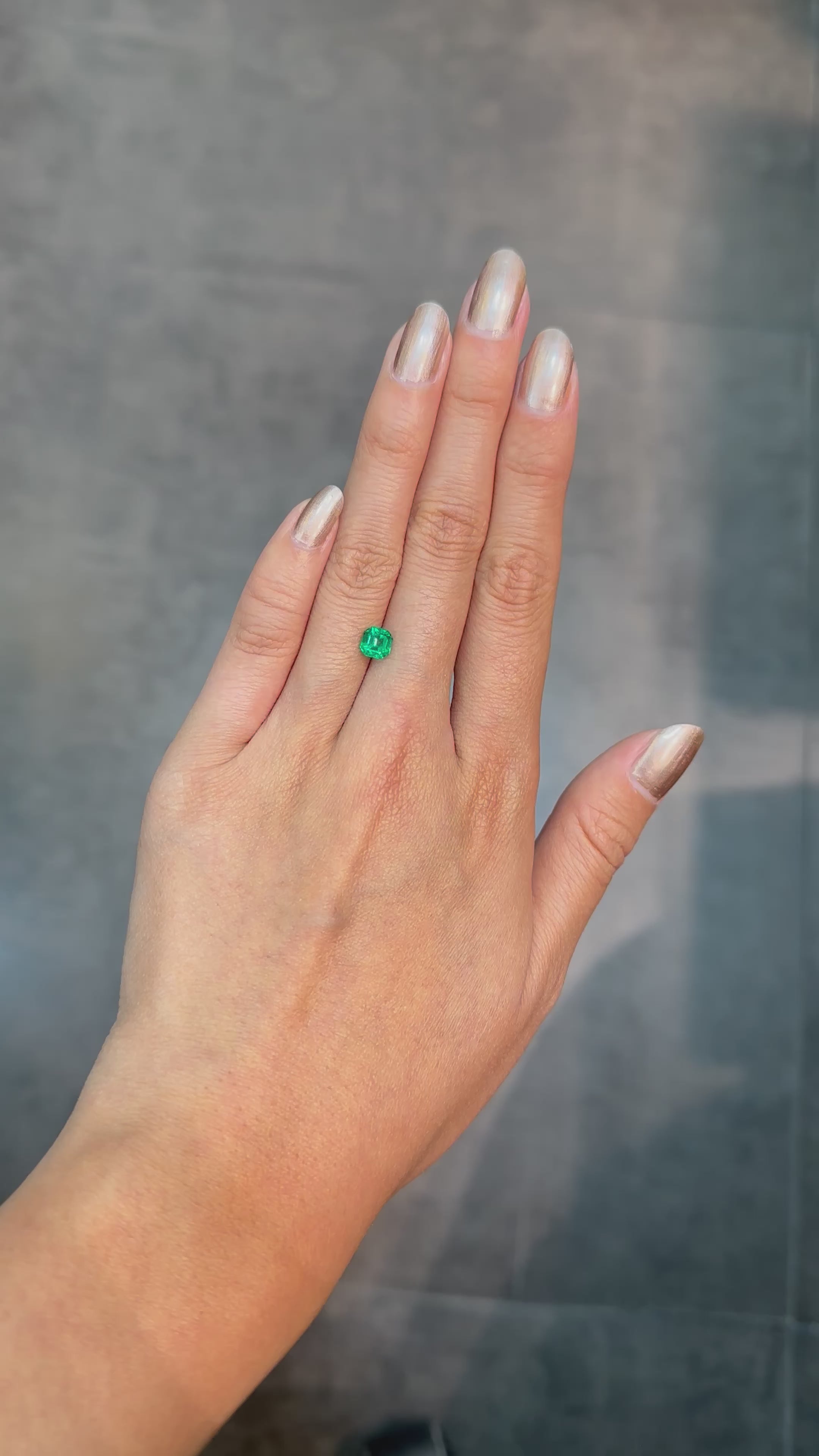 0.82 ct square Colombian emerald with striking green color and a clean geometric shape